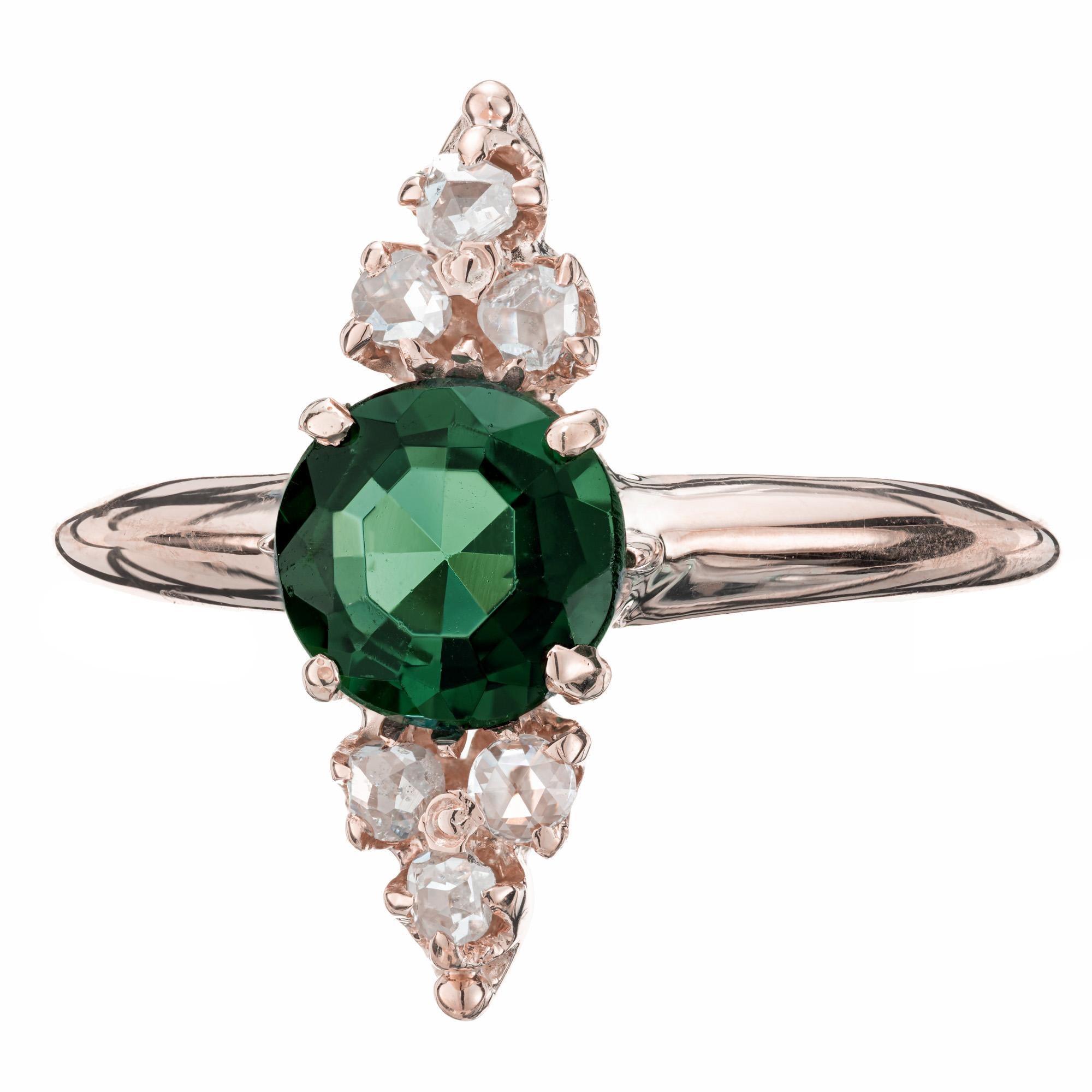 Late 1800's, Handmade tourmaline and diamond ring. 1 round eight sided tourmaline center stone with 3 rose cut accent diamonds on top and bottom of center stone. 14k rose gold setting. 

1 round 8 sided green tourmaline, VS approx. 1.00cts
6 rose