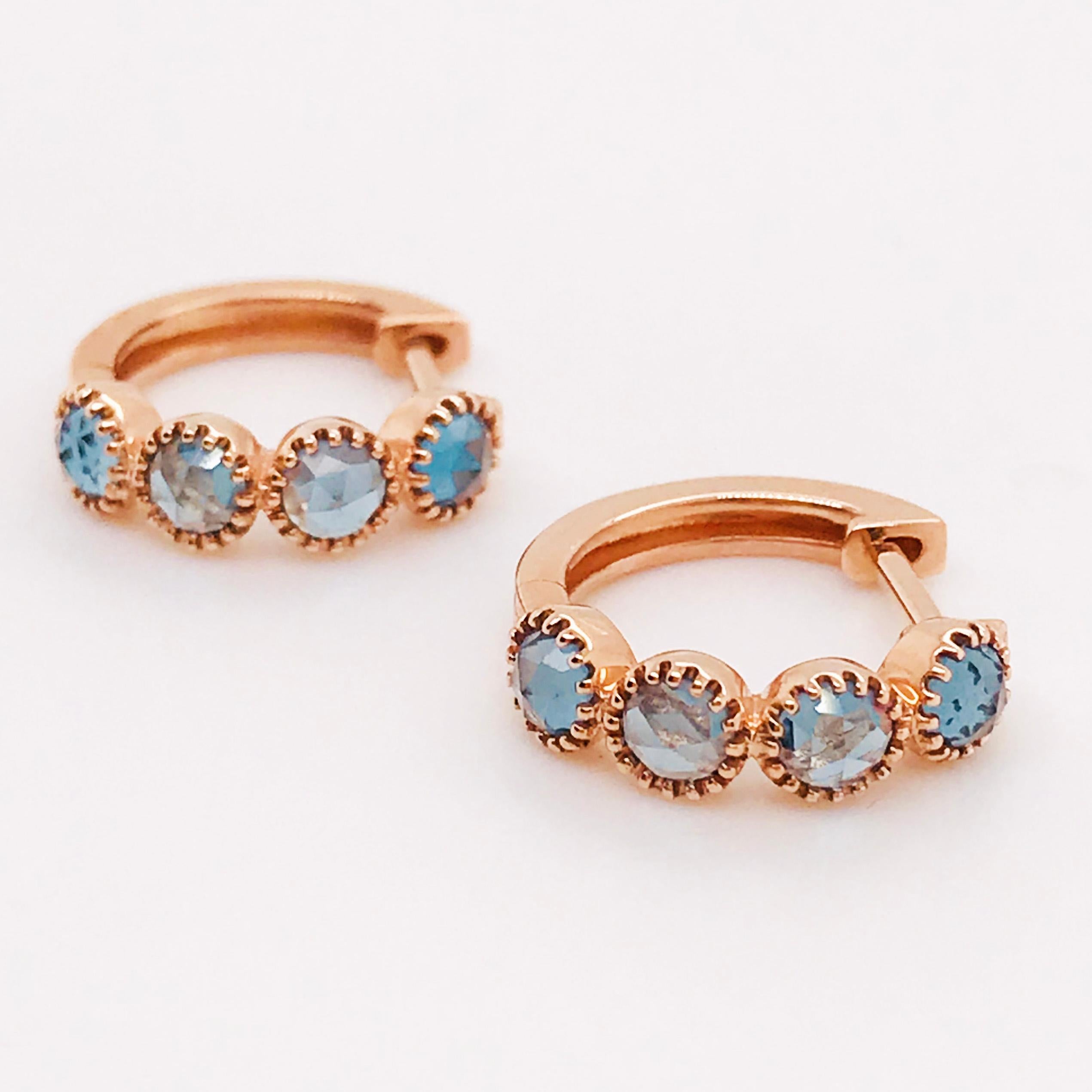 These mini hoop earrings (or huggies) are so special and unique. With genuine London blue topaz gemstones set in rose gold beaded settings. The ocean blue gemstone is complimented beautifully with the rose gold settings. These earrings are a great