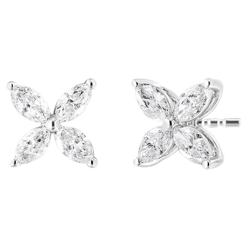 The classic arrangement of 8 stunning, earth mined marquise diamonds make these studs an instant classic. These studs are crafted out of stunning 14k white gold and set with 8 high-quality, genuine marquise diamonds in a floral arrangement. The