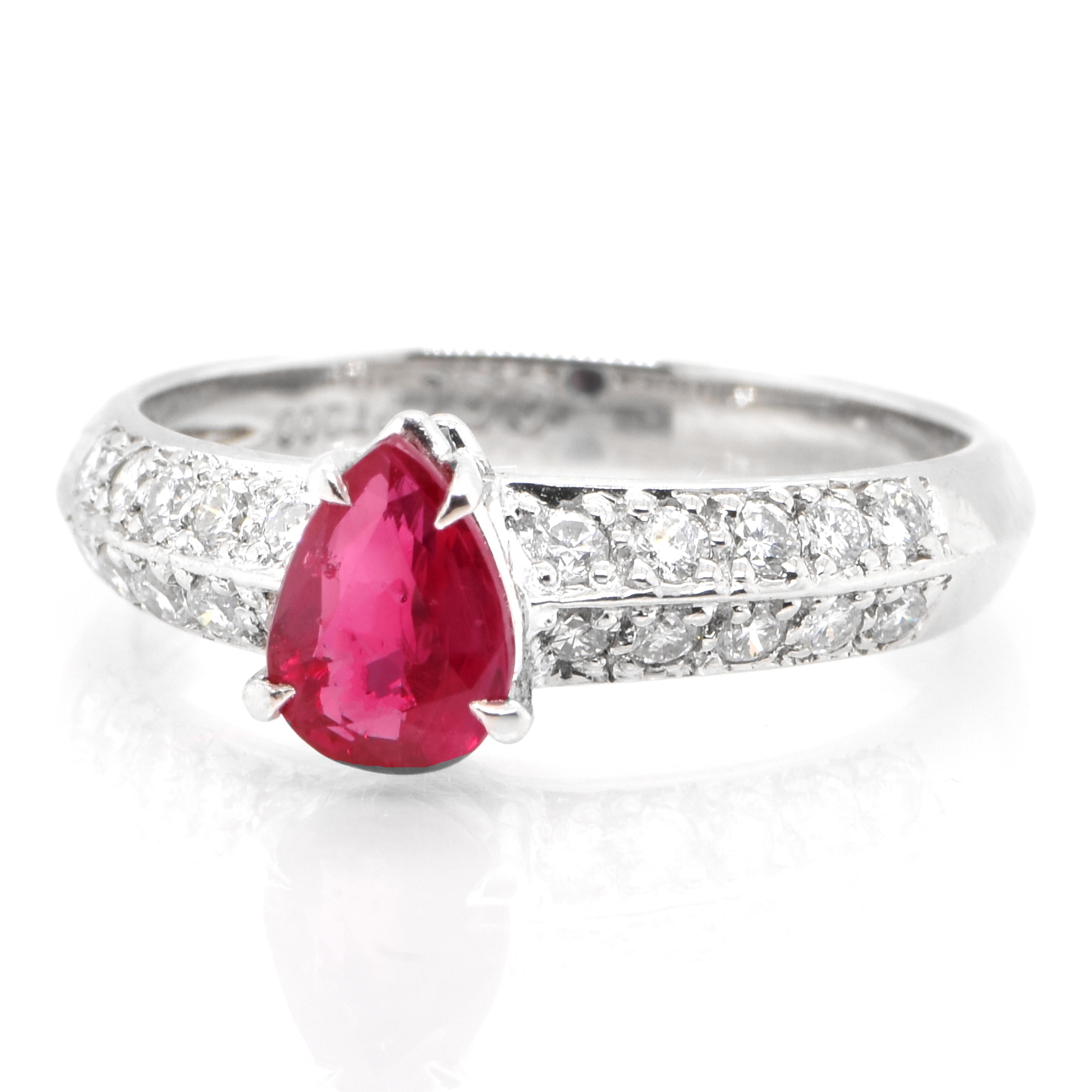 A beautiful ring set in Platinum featuring a 1.00 Carat Natural Pear Cut Ruby and 0.35 Carat Diamonds. Rubies are referred to as 