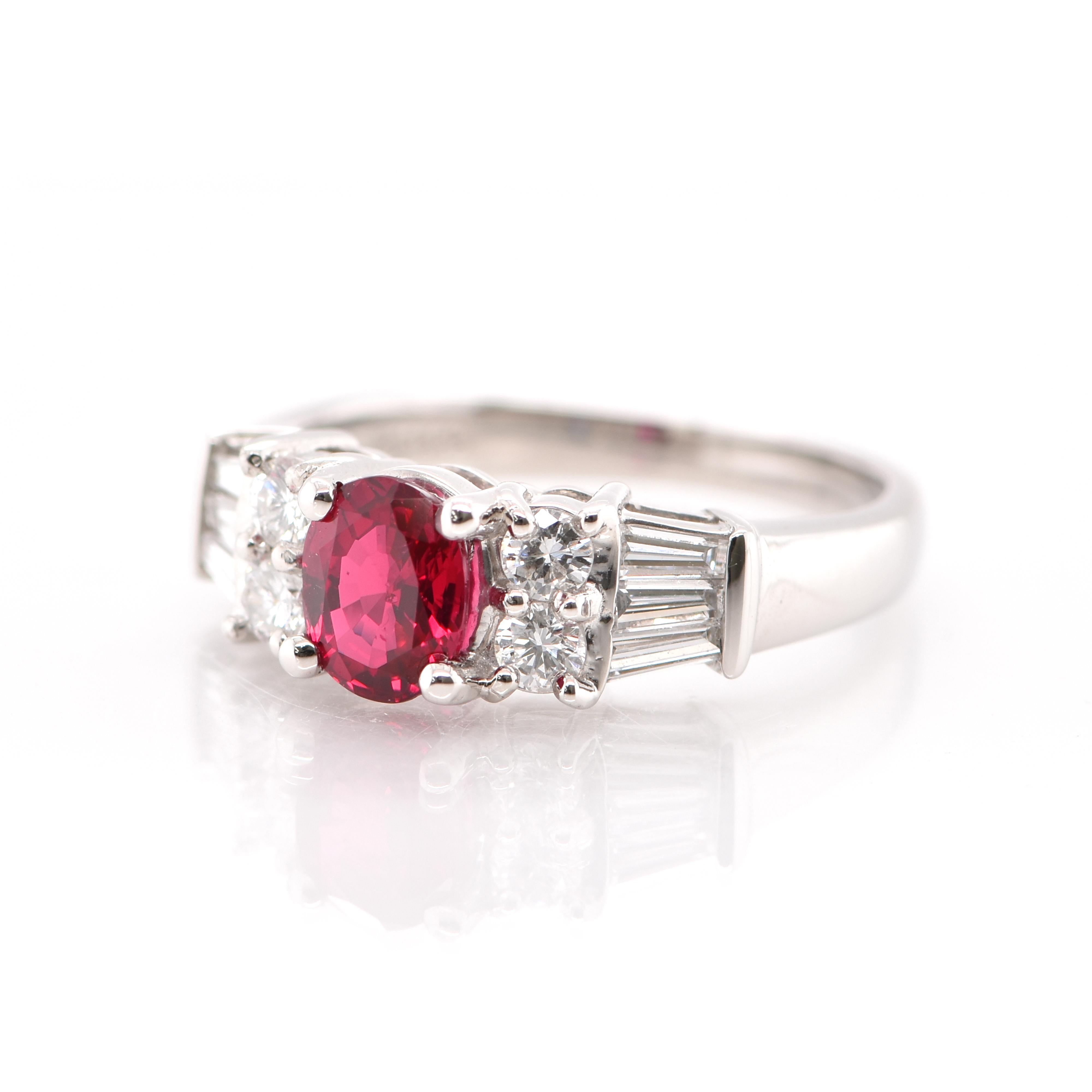 A beautiful Engagement Ring featuring a 1.00 Carat Natural Ruby and 0.58 Carats of Diamond Accents set in Platinum. Rubies are referred to as 