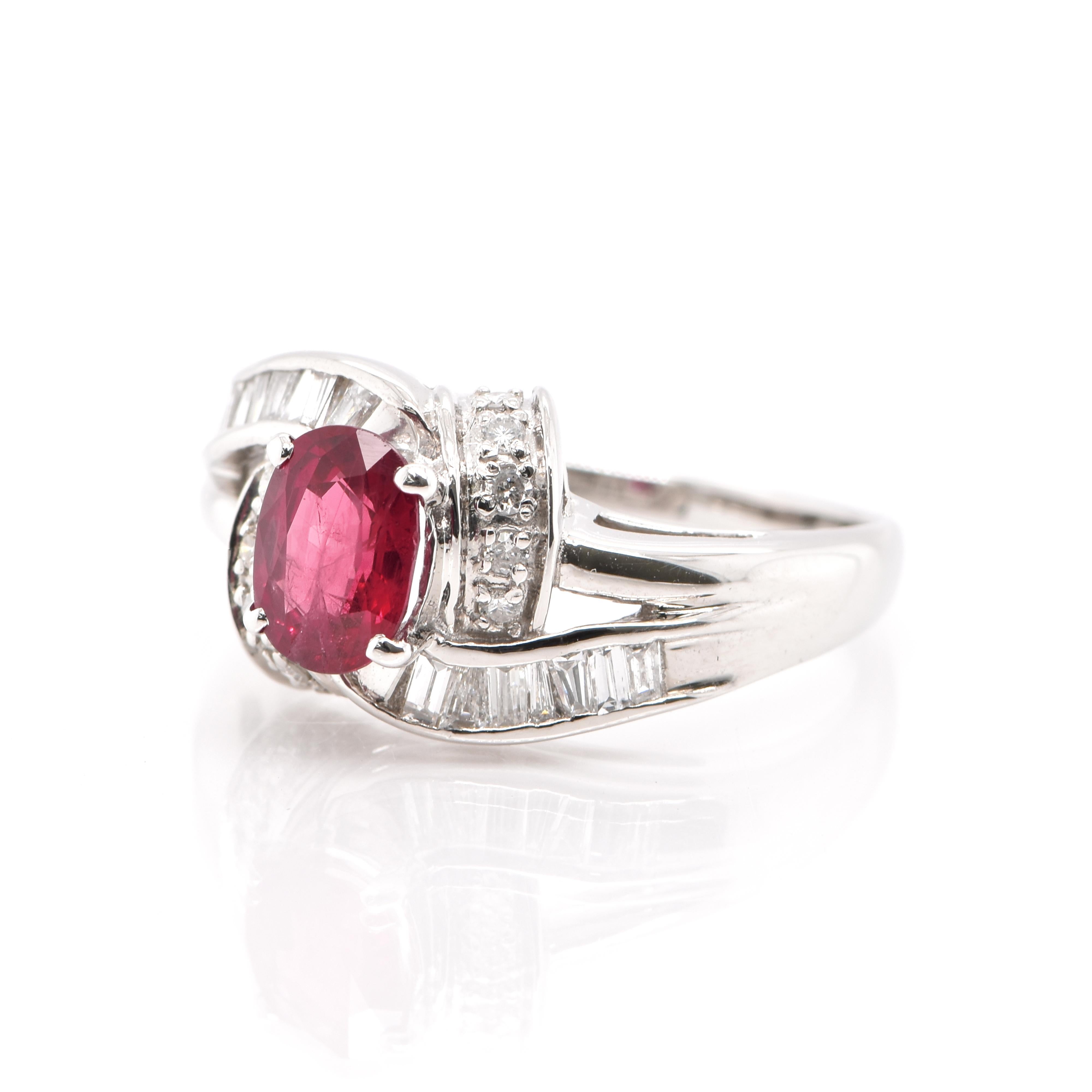 A beautiful Ring featuring a 1.00 Carat Natural Ruby and 0.30 Carats of Diamond Accents set in Platinum. Rubies are referred to as 