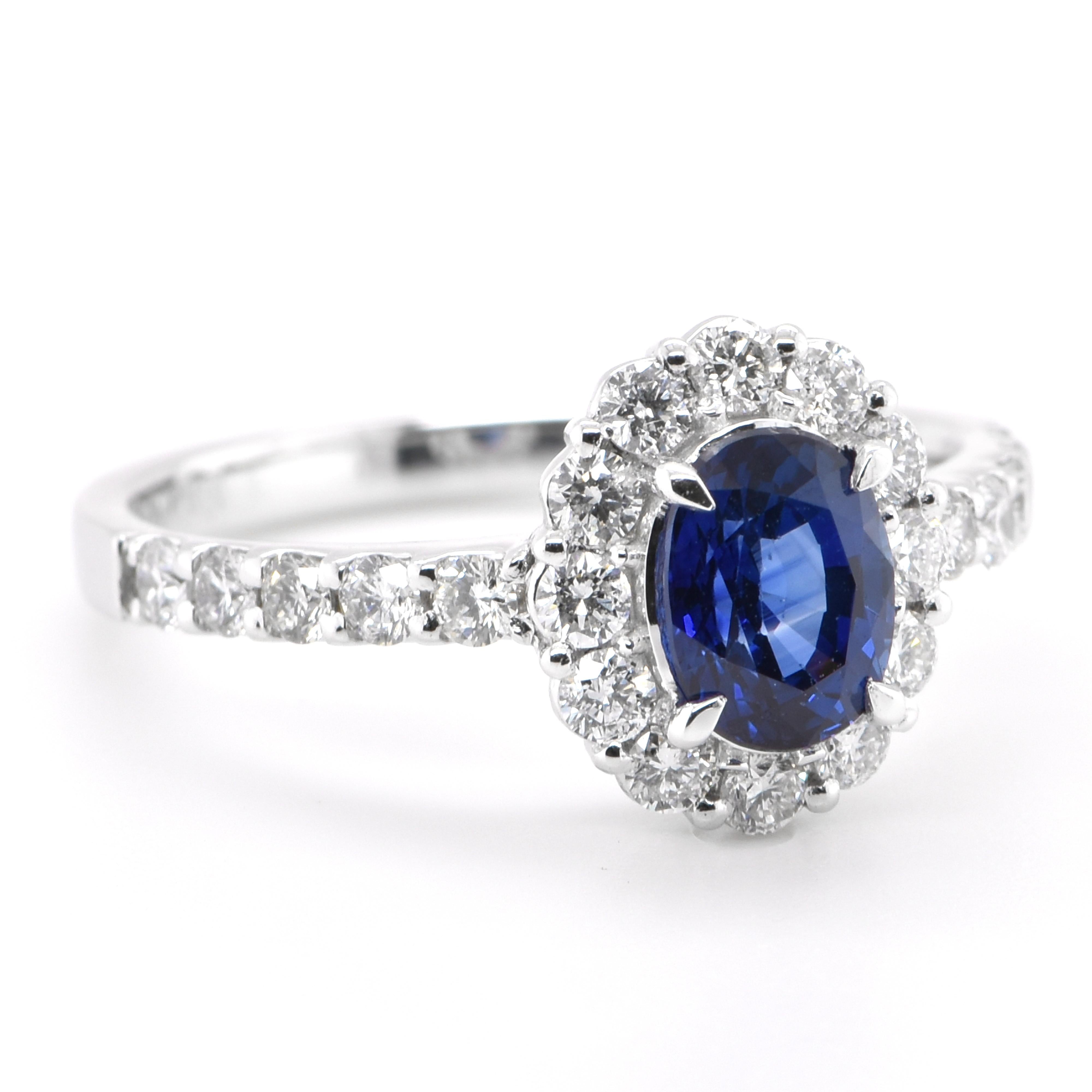 Modern 1.00 Carat Natural Sapphire and Diamond Halo Ring Set in Platinum For Sale