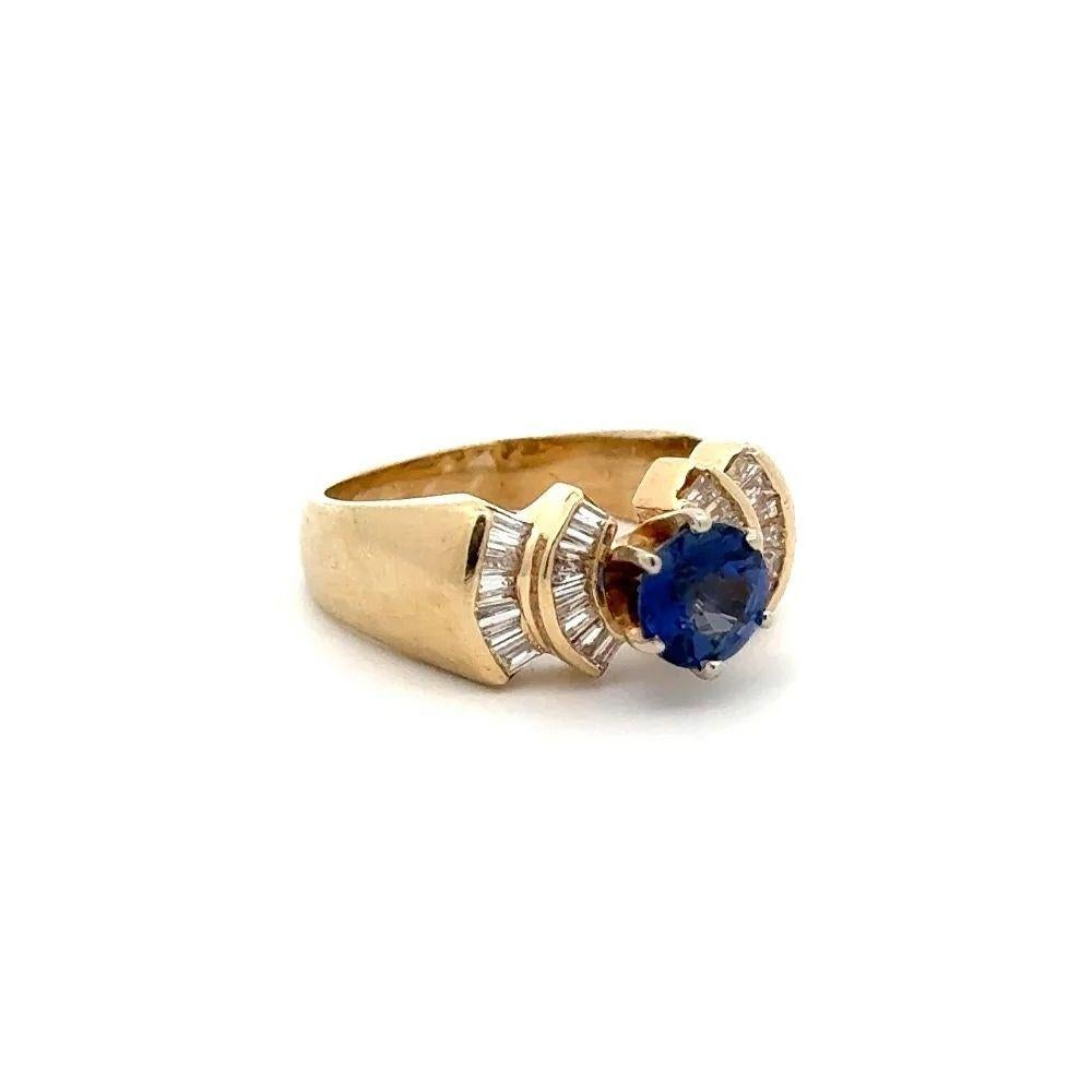 Simply Beautiful! Sapphire Diamond and Diamond Vintage Gold Cocktail Ring. Centering a securely nestled Hand set Round Natural Blue Sapphire weighing 1.00 Carat. Enhanced Half Circle sides with Baguette Diamonds, weighing approx. 0.70tcw.