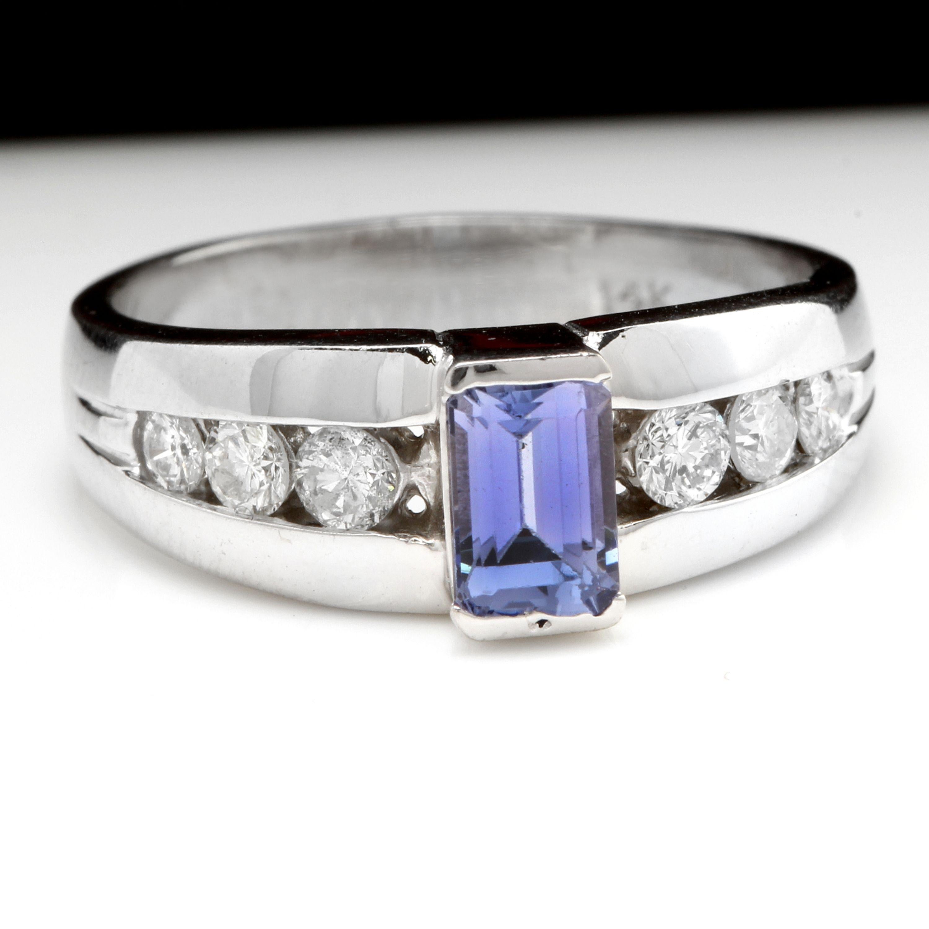 1.00 Carat Natural Very Nice Looking Tanzanite and Diamond 14K Solid White Gold Ring

Total Natural Emerald Cut Tanzanite Weight is: Approx. 0.68 Carats

Tanzanite Measures: 6 x 4mm

Tanzanite Treatment: Heat

Natural Round Diamonds Weight: Approx.