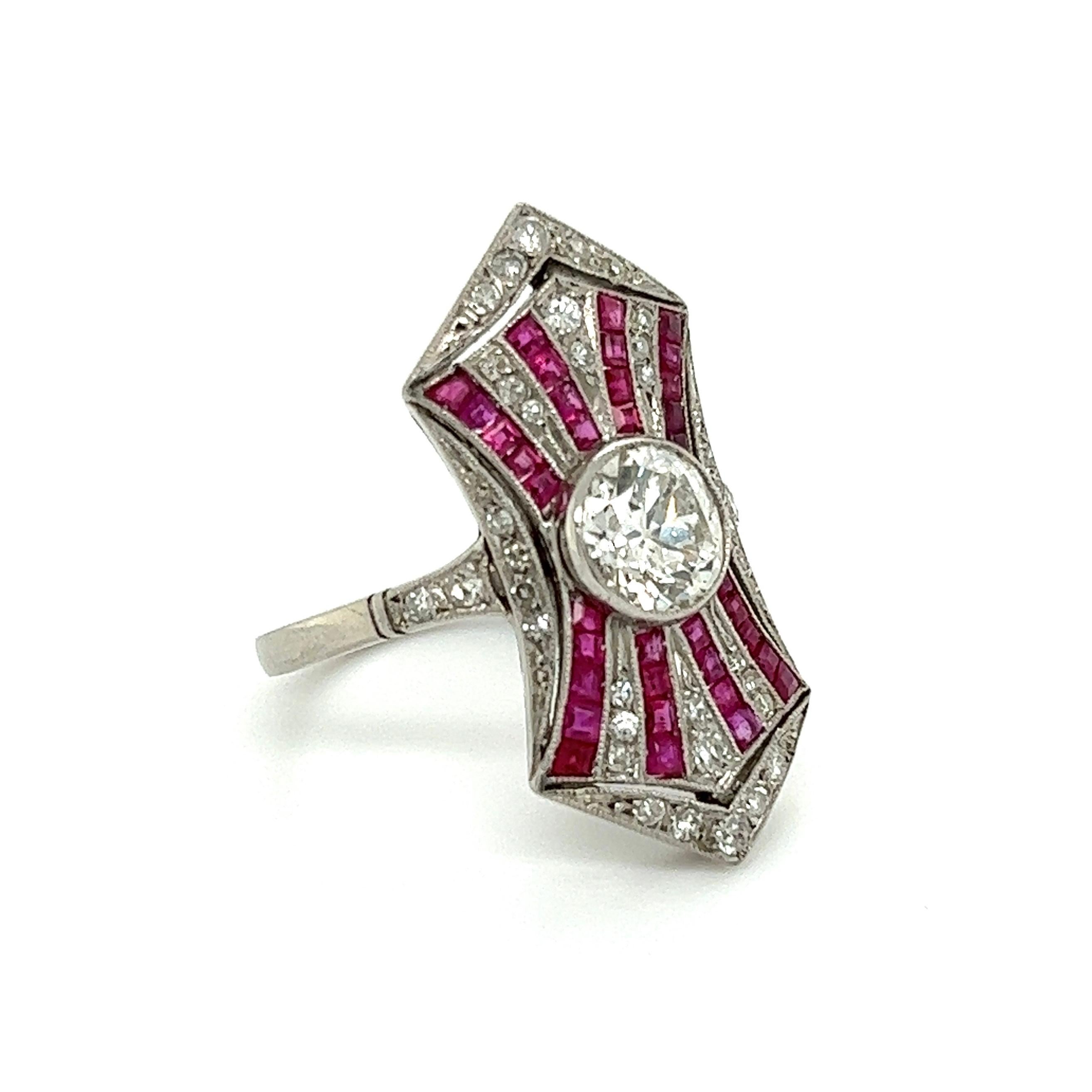 Simply Beautiful! Diamond and Ruby Art Deco Revival Platinum Cocktail Ring. Centering a securely nestled Hand set Old European-cut Diamond weighing approx. 1.00 Carat. Surrounded by Rubies approx. 1.30tcw and Diamonds approx. 0.40tcw. Hand crafted