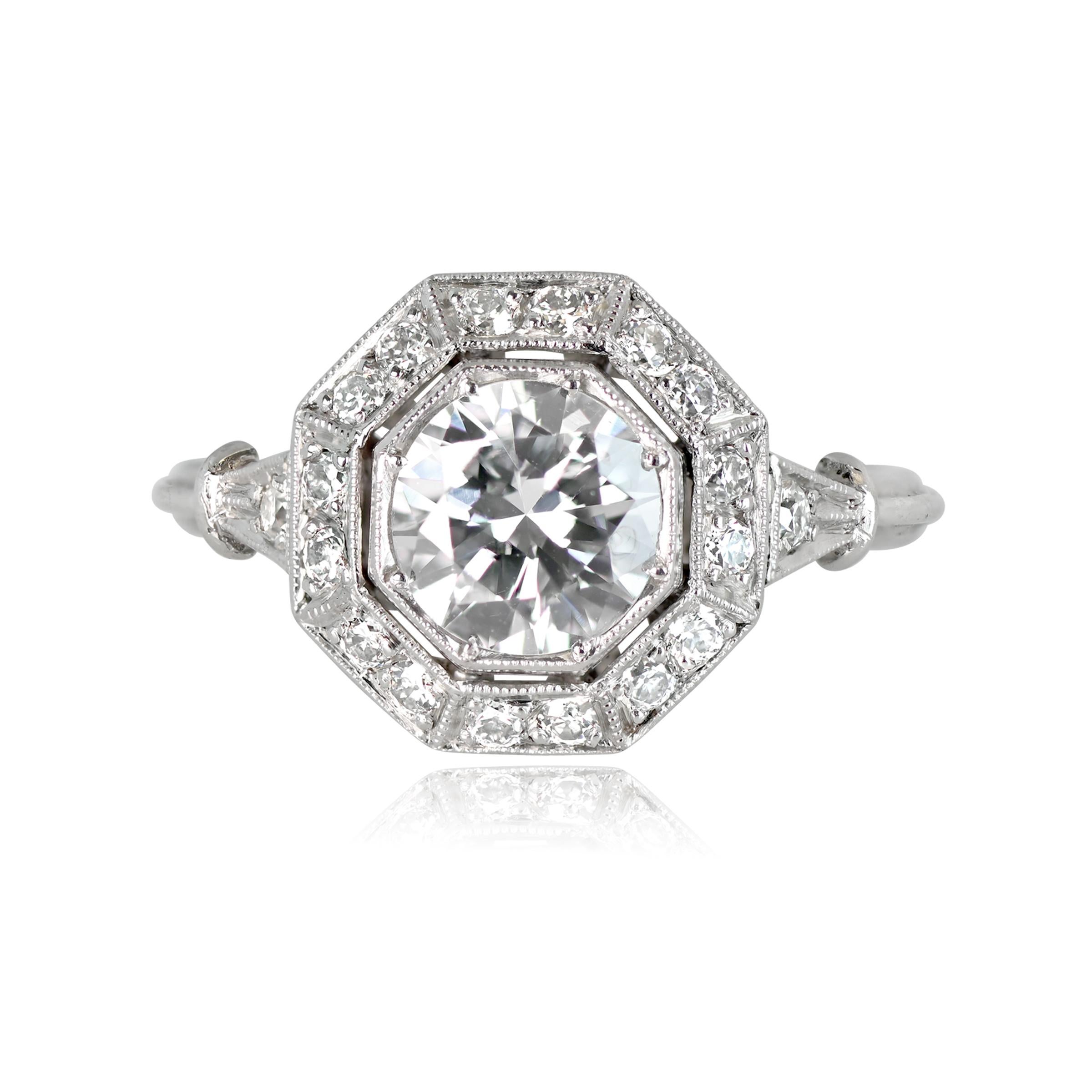 Introducing a stunning geometric diamond engagement ring, showcasing a vibrant 1.00 carat old European cut diamond (H color, SI1 clarity) at the center, elegantly surrounded by an octagonal halo of old European cut diamonds. The ring also features a