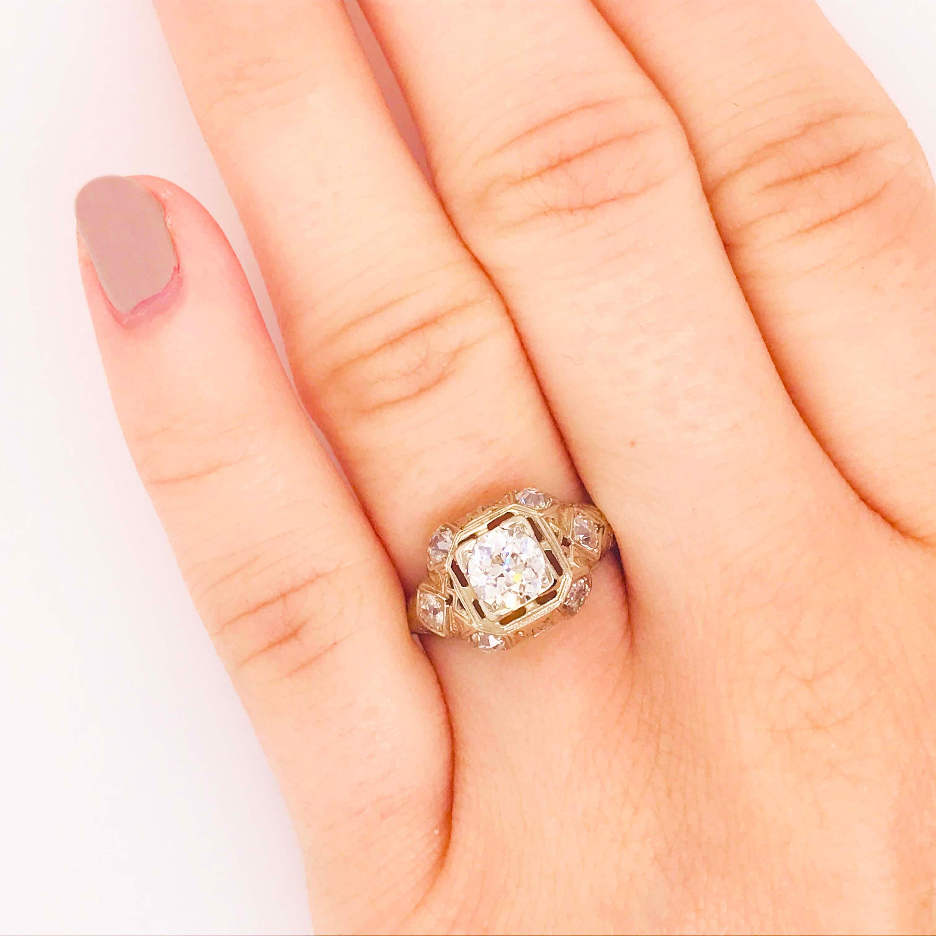 This original CIRCA 1925 Art Deco Diamond Engagement Ring in Platinum is amazing! With all the original diamonds and platinum, this estate ring is in great condition! 
Center in the center is the original, natural Old European cut diamond that is
