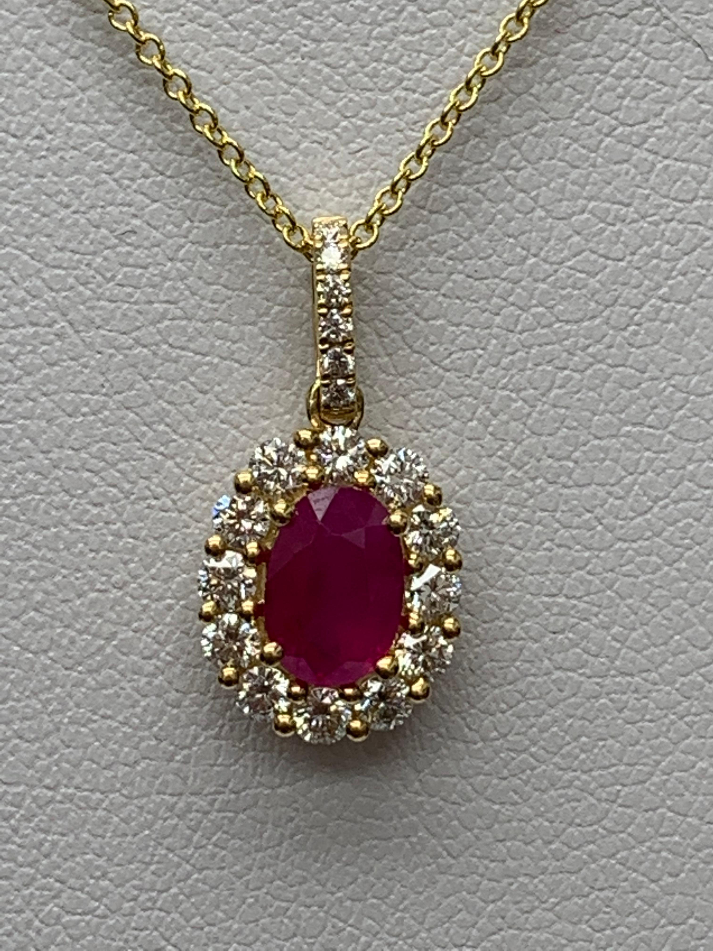 A simple pendant necklace showcasing a vibrant 1-carat oval cut red ruby, surrounded by 
0.43 carats of 18 accent round diamonds. Made in 18 karats white gold.

Style is available in different price ranges. Prices are based on your selection of the