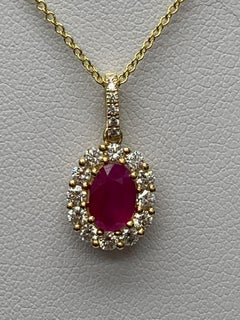 1.00 Carat Oval Cut Ruby and Diamond Halo Pendant Necklace in 18K Yellow Gold