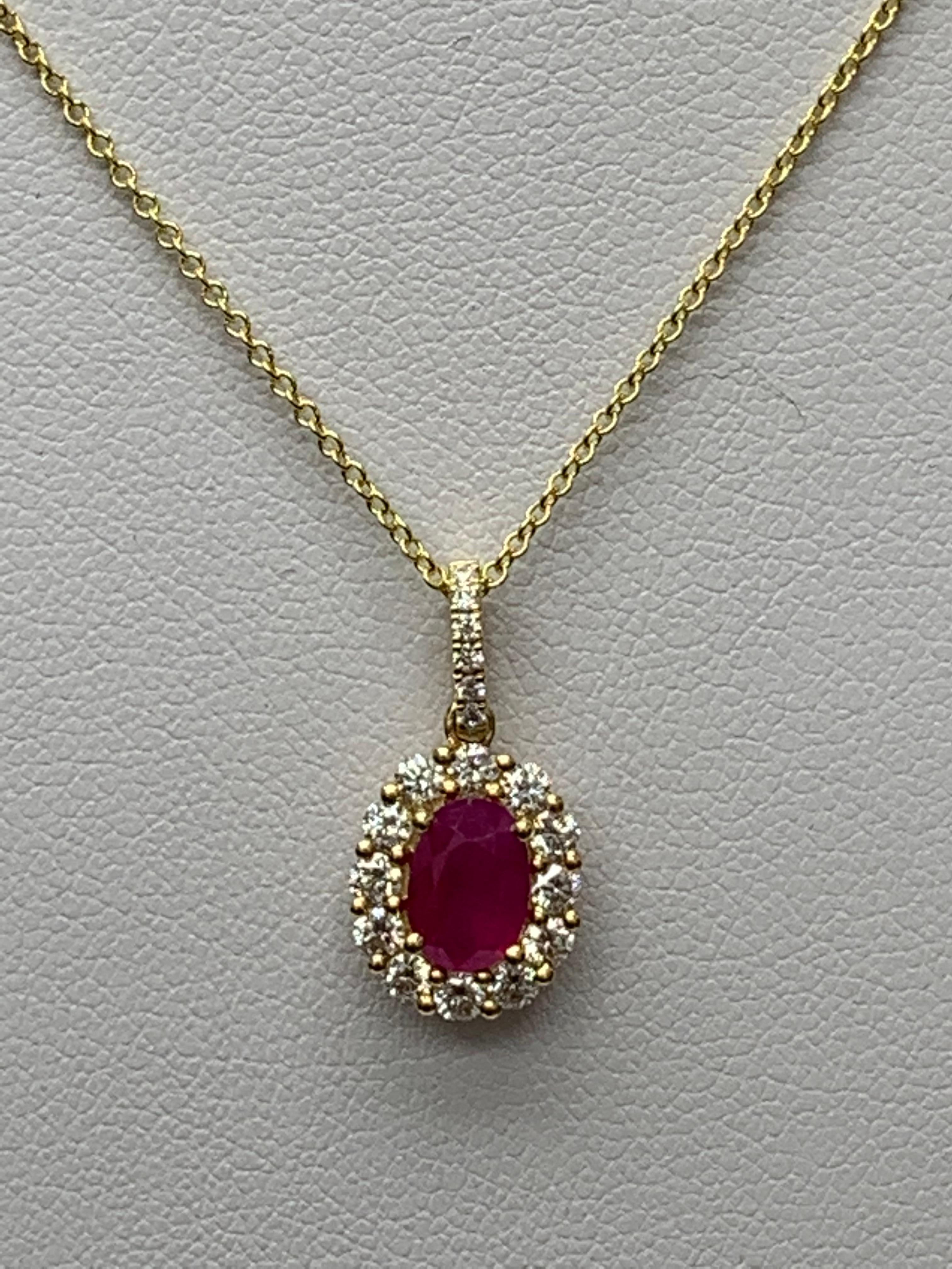 Modern 1.00 Carat Oval Cut Ruby and Diamond Halo Pendant Necklace in 18K Yellow Gold For Sale
