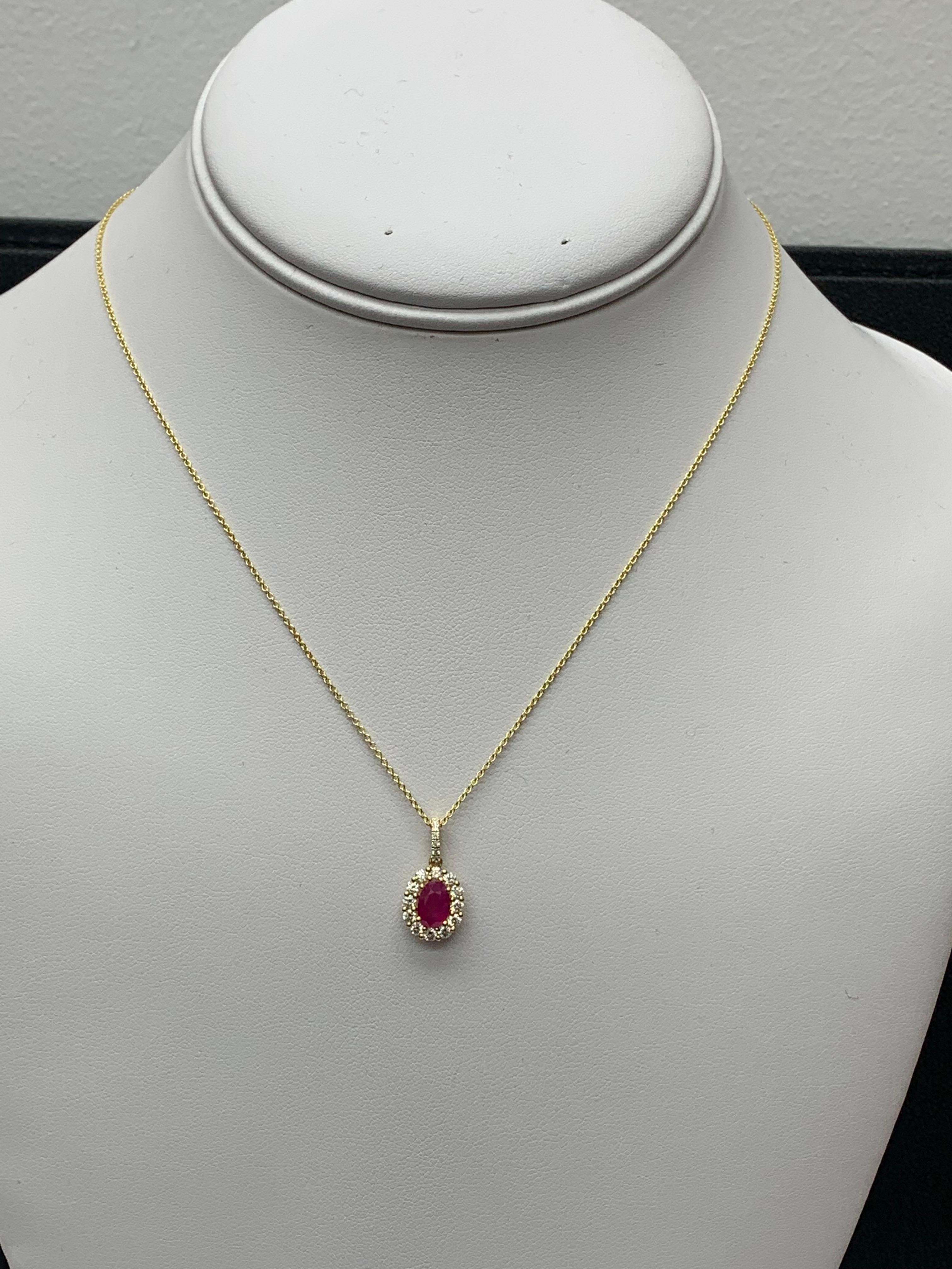 1.00 Carat Oval Cut Ruby and Diamond Halo Pendant Necklace in 18K Yellow Gold In New Condition For Sale In NEW YORK, NY