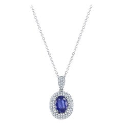 1.00 Carat Oval Cut Sapphire and Diamond Pendant in 18K White Gold