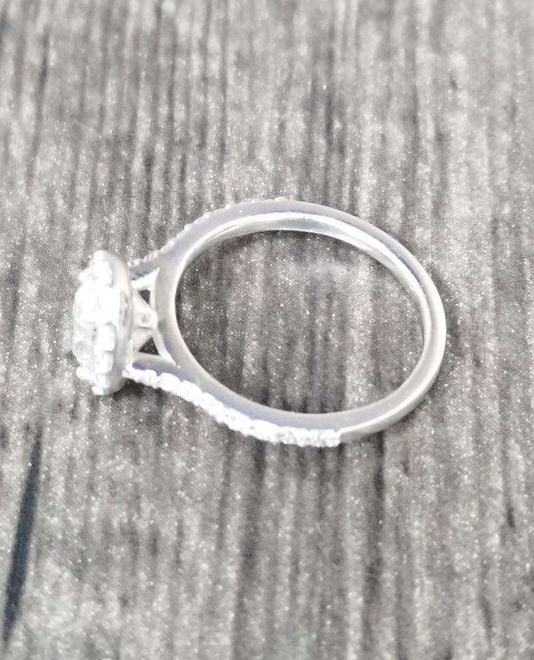 Contemporary 1.00 Carat Oval Diamond Halo Ring