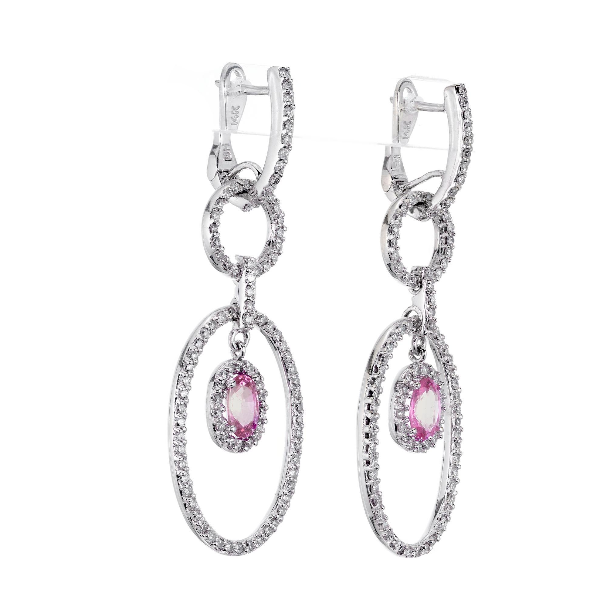 Pink oval sapphire and diamond five section 14k white gold dangle earrings. The center sections is set with oval medium pastel pink Sapphires with 172 round accent diamonds. 

172 round diamonds full cut G-H, SI1 approx. total weight 1.00cts
2 oval