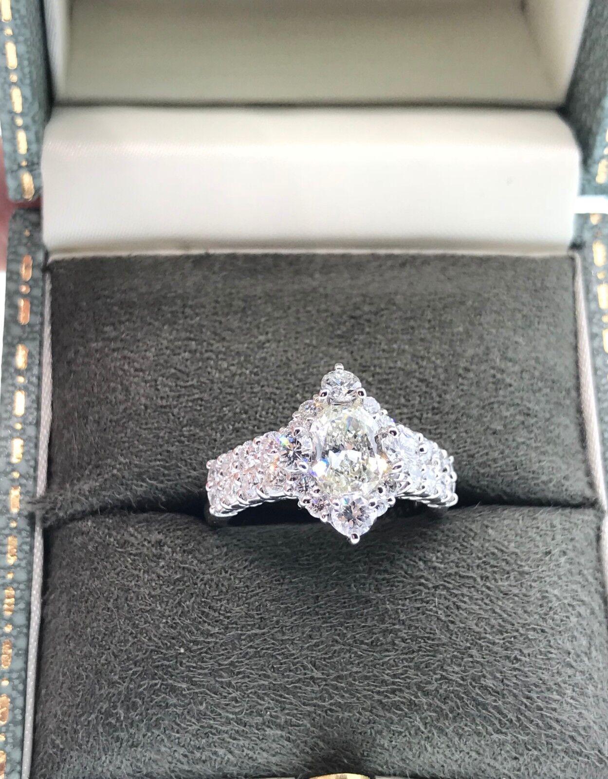 Oval Brilliant Diamond Ring in Platinum

Oval Brilliant Diamond Ring features an Oval Brilliant cut Diamond center surrounded by a halo of Round Brilliant Diamonds set in a Platinum setting.

The center diamond weighs 1.00 carat.
Total weight of
