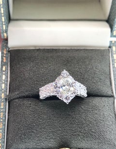 1.00 carat Oval Shaped Diamond in Round Diamond Halo Platinum Ring