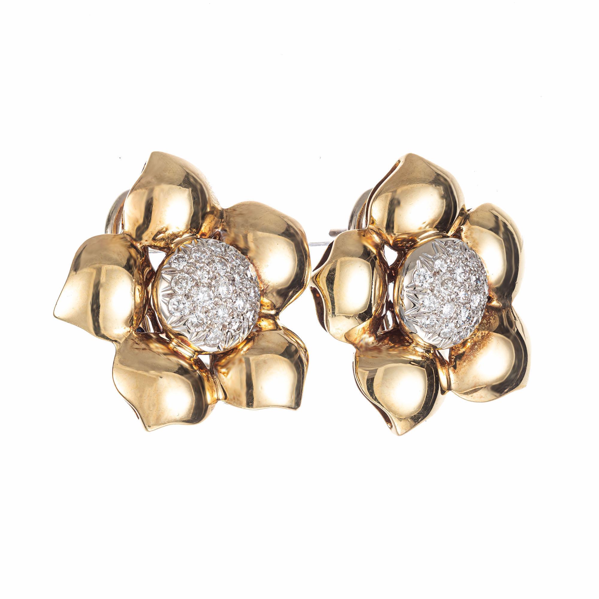 1960's 3-D flower style diamond clip post earrings. 38 round pave set diamond domed, 18 white gold clusters with 18k yellow gold flower petal halos. Secure posts and omega backs. The earrings are flat on the back and sit perfectly on the lobe. They