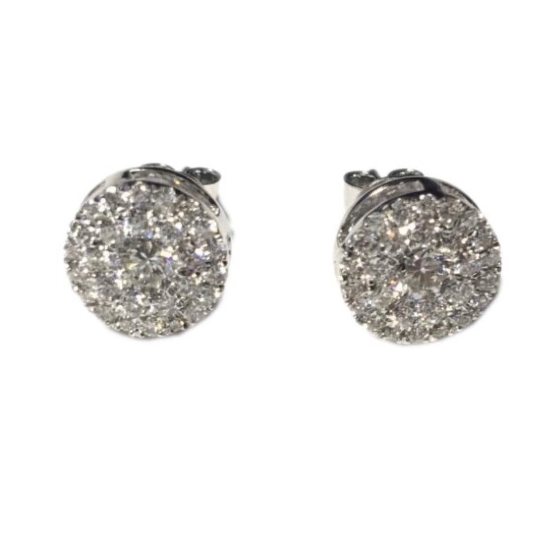 These elegant Round Brilliant Cut Diamond cluster stud earrings featuring white eye clean color H clarity SI diamonds that sparkle, set in 18 Karat White Gold. These button shaped pave set cluster studs have a total diamond weight of 1.00 Carat and