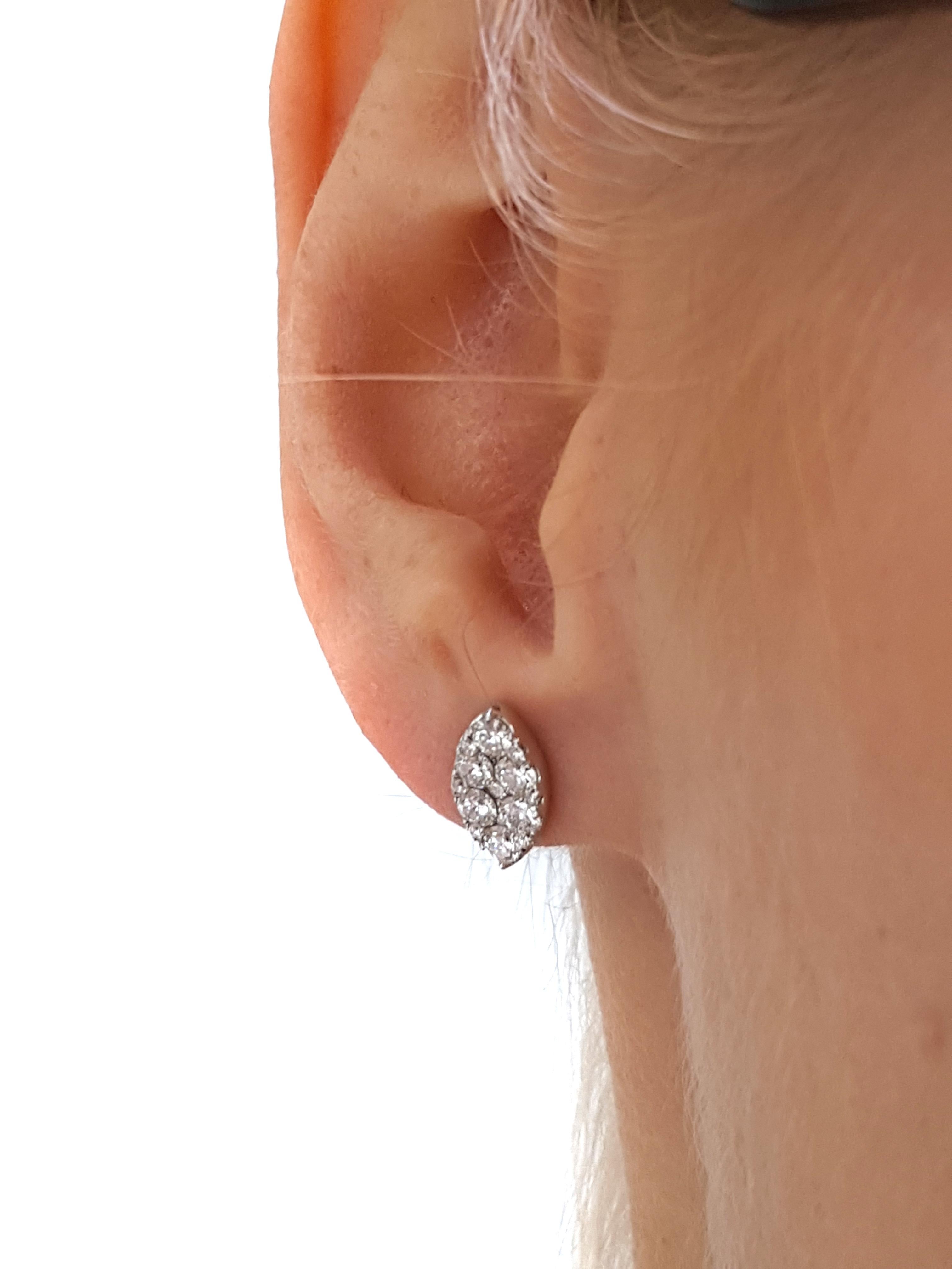 These eye catching elegant Round Brilliant Diamond cluster stud earrings featuring a white color H clarity SI sparkling Diamonds set in 18 Karat White Gold. These Marquise shaped pave set cluster studs have a total diamond weight of 1.00 Carat and a