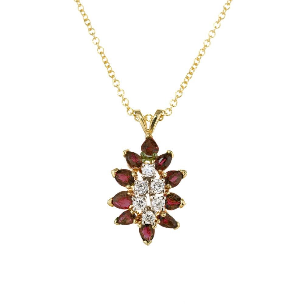 1970's Ruby and diamond pendant necklace. 6 round cut diamonds set in 18k yellow gold with 10 pear shaped red rubies totaling 1.00cts. with a 16 inch 18k yellow gold chain. 

10 pear shape red rubies, approx. 1.00ct
6 round diamonds, G-H VS SI