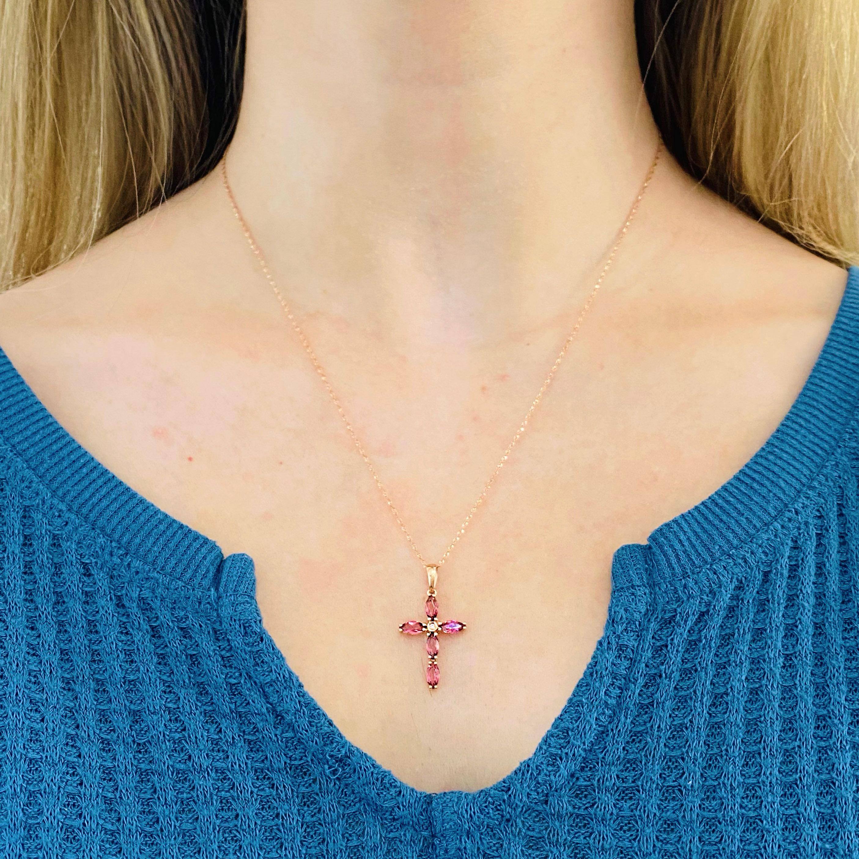 This stunningly beautiful cross made of bright pink stones set in polished 14k rose gold and accented with a bright white diamond provides a look that is very modern yet classic! This necklace is very fashionable and can add a touch of style to any
