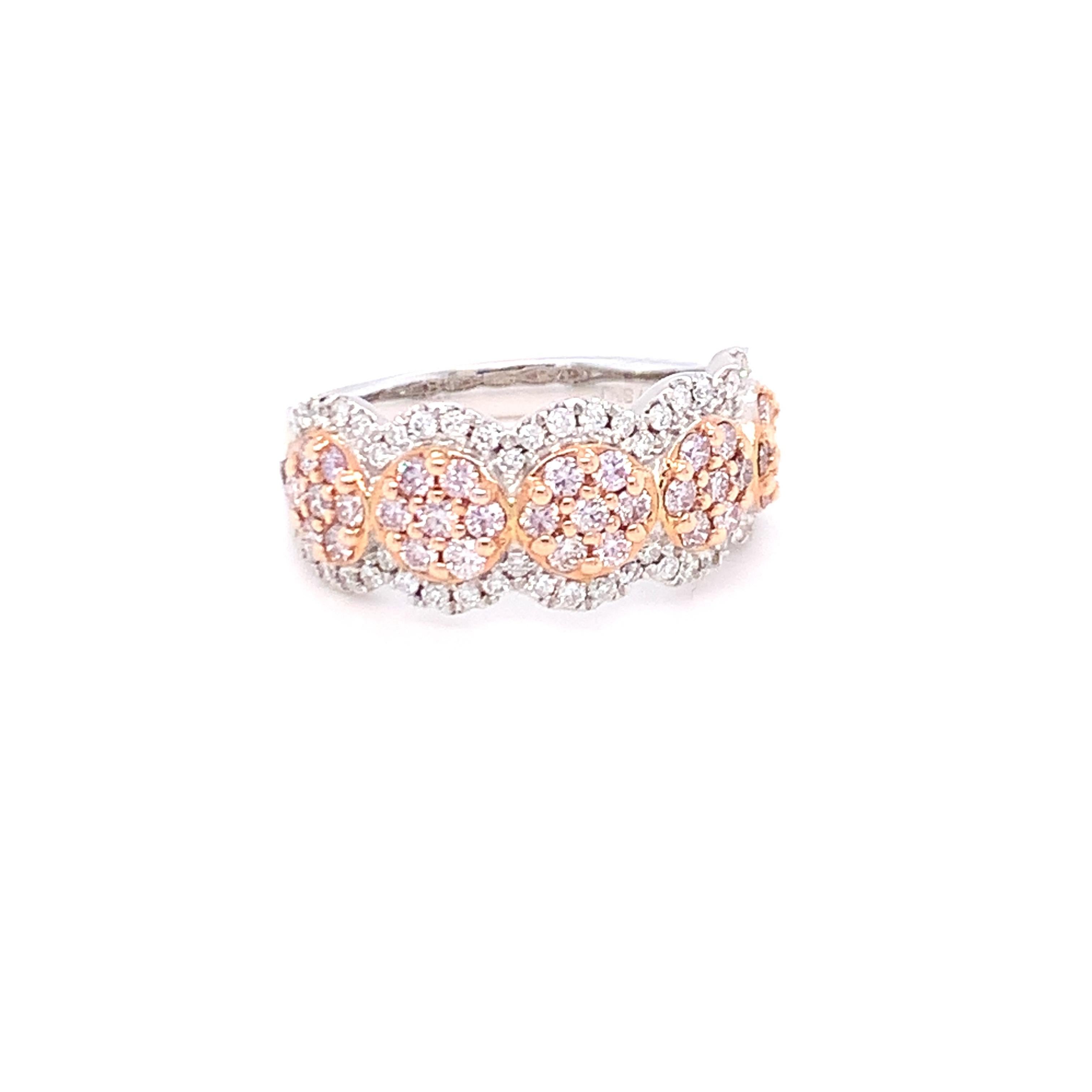 A perfect blend of pink and white diamonds in clusters gives this band a sophisticated and delicate look. Set in two tone gold and carefully finished with skilled hands.
Pink Diamond: 0.70ct
White Diamond: 0.30ct
Gold: 14K Two Tone
Ring Size:7