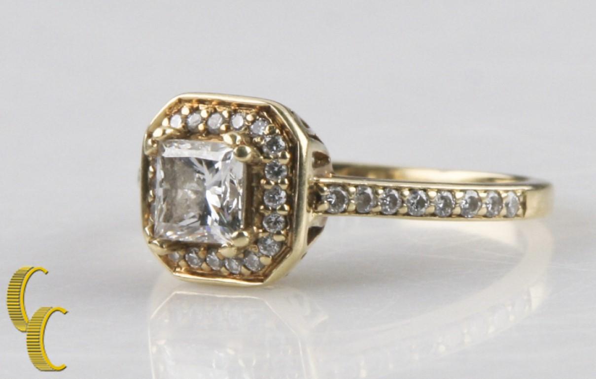 Gorgeous, Unique 14k Yellow Gold Diamond Engagement Ring
Features Solitaire Princess Cut Diamond with 36 Round Brilliant Halo & Accent Stones
Weight of Princess-Cut Solitare = 0.75 ct
Color: At least I
Clarity: At least VS-2
Total Diamond Weight of