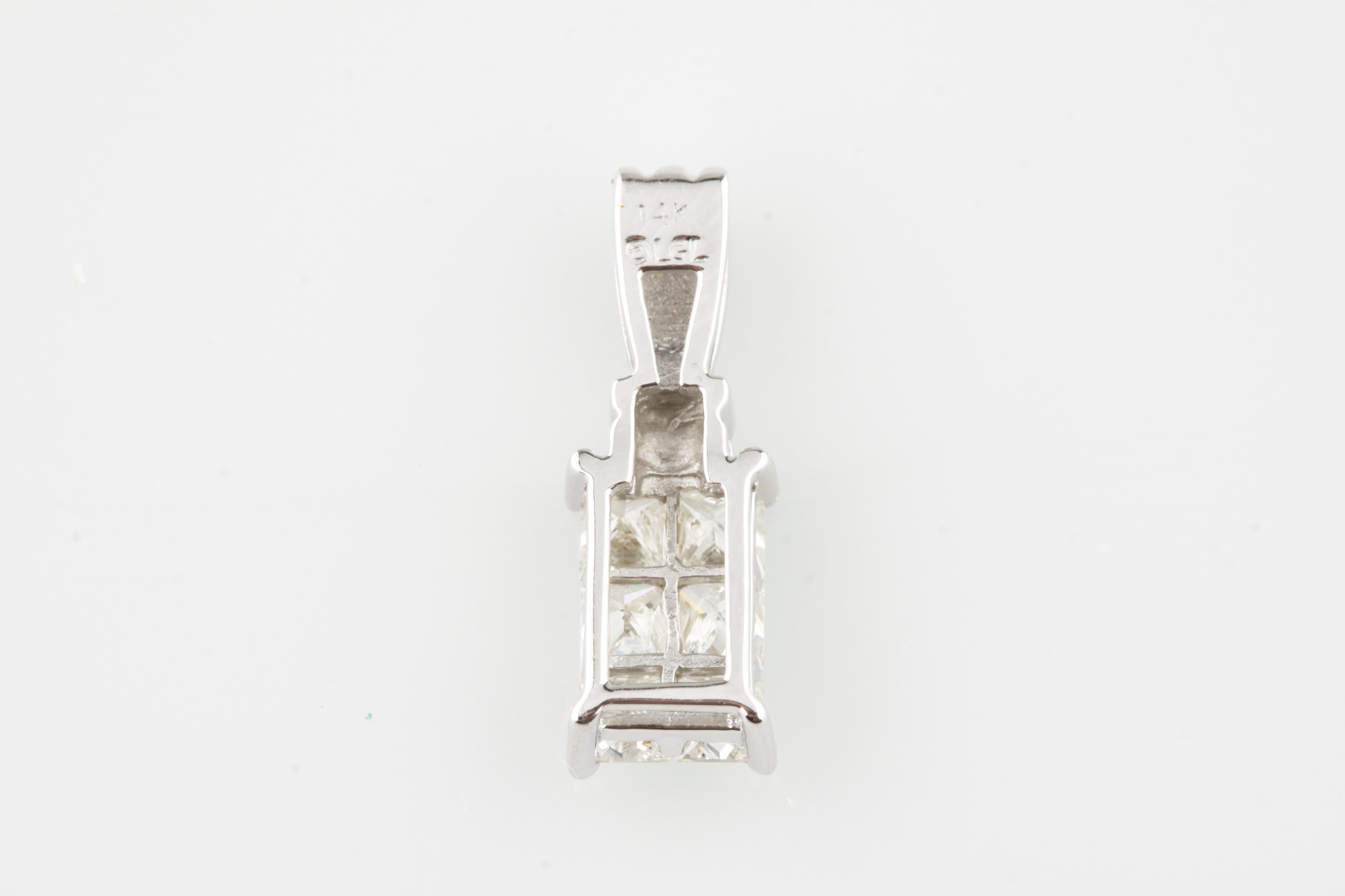 Gorgeous Diamond Pendant Set in 14k White Gold
Features Six Princess Cut Diamonds in Invisible Plaque Setting
Total Diamond Weight = 1.00 ct
Total Mass = 1.5 grams
Gorgeous Pendant! (Chain Not Included)