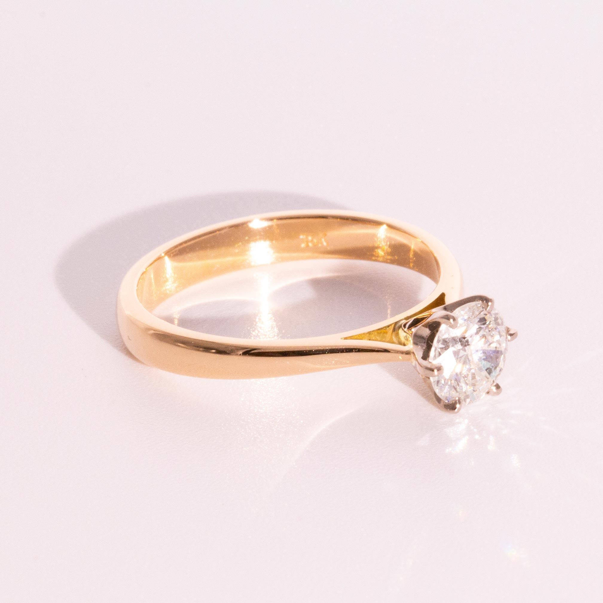 Crafted in 18 carat gold is the alluring solitaire engagement ring that show cases a sparkling 1.00 carat round brilliant cut diamond. We have named this gorgeous ring The Livia Ring. The Livia Ring is an understated elegant engagement ring with her