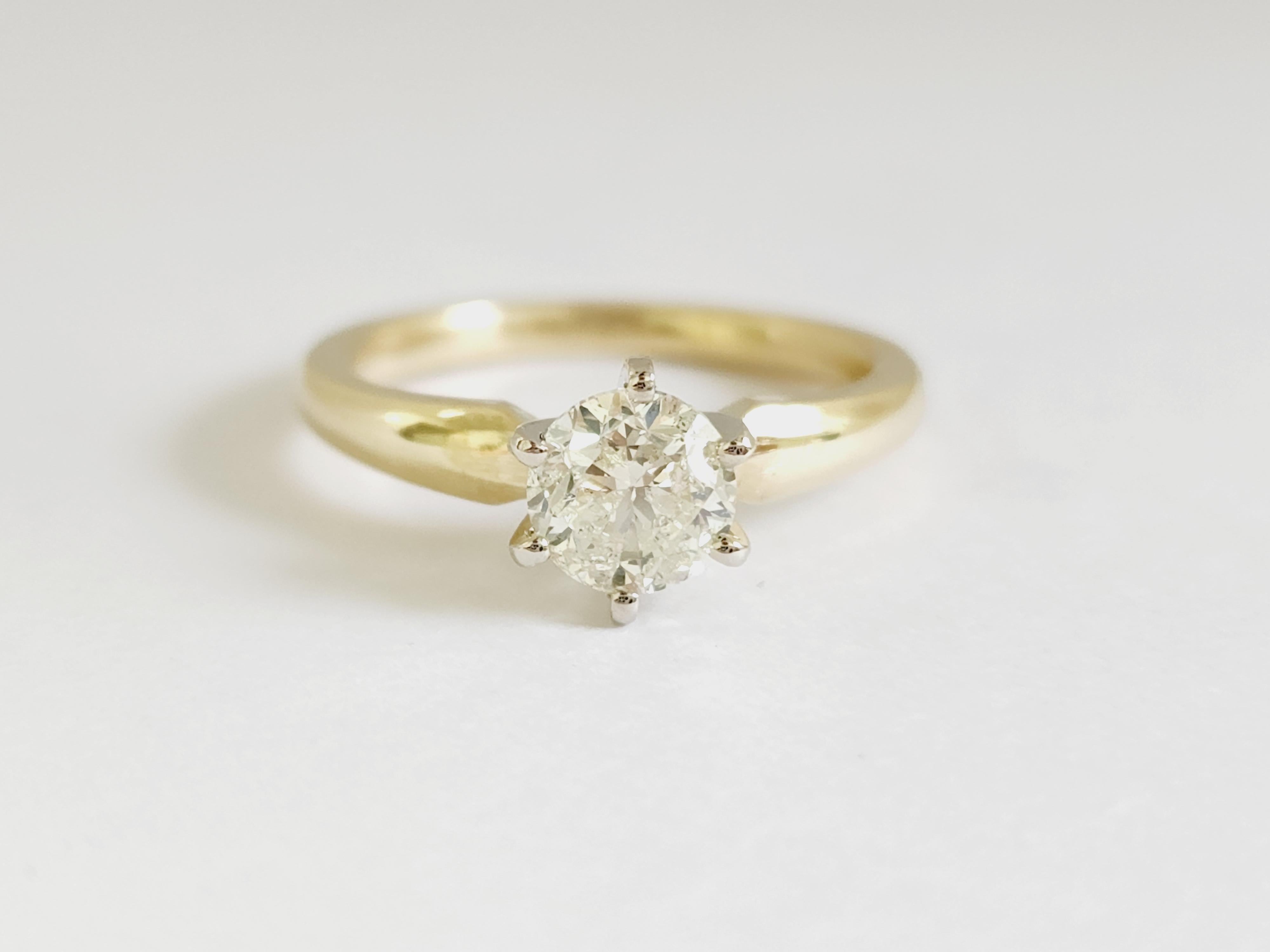 1 ct round brilliant cut natural diamonds. 6 prong solitaire setting, set in 14k yellow gold. Ring Size 6.5