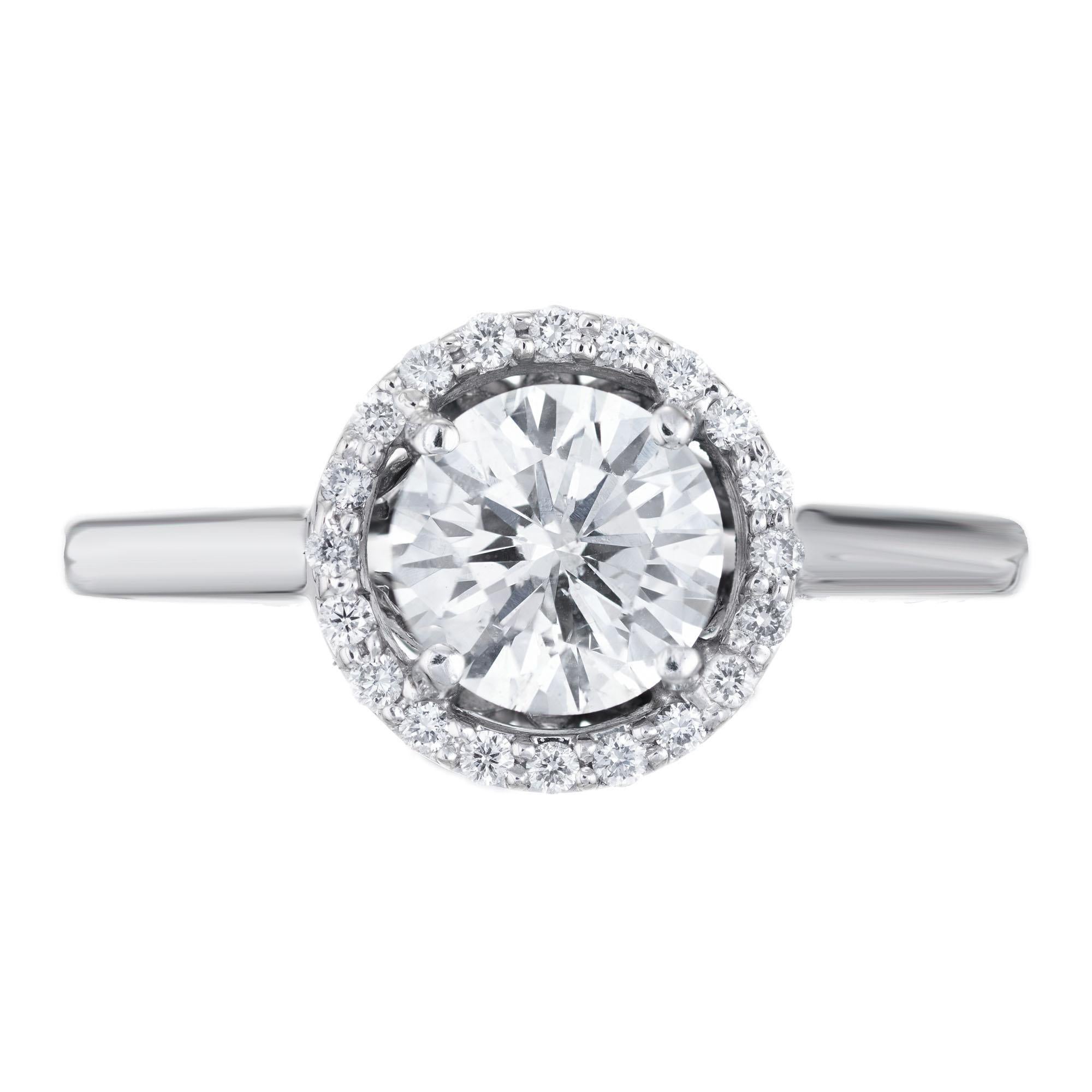 EGL certified round diamond center stone in a 14k white gold setting with a halo of 22 round ideal cut diamonds. 

1 Ideal round brilliant cut diamond, approx. total weight 1.00cts, I to J, SI2, eye clean, 6.37 x 6.35 x 3.85mm, Depth: 60.5%, Table: