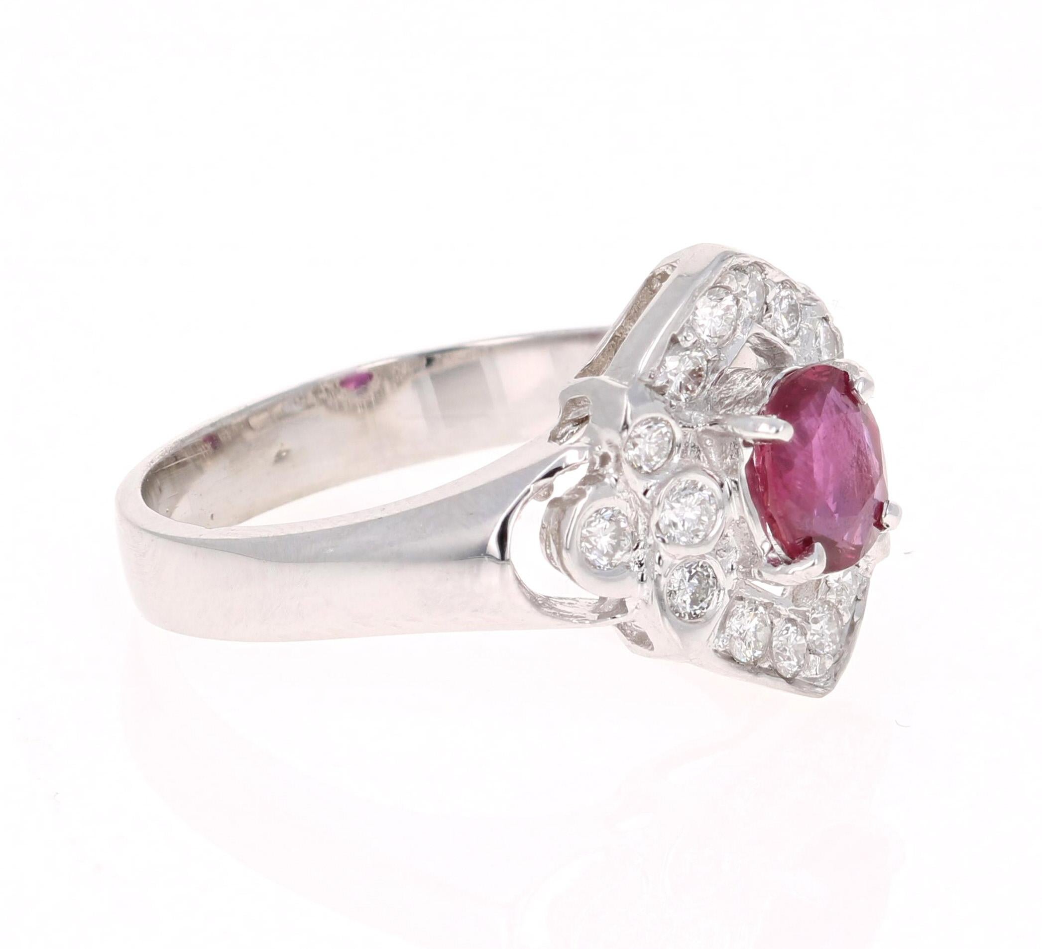 Simply beautiful Ruby Diamond Ring with a Oval Cut 0.65 Carat Burmese Ruby which is surrounded by 28 Round Cut Diamonds that weigh 0.35 carats. The total carat weight of the ring is 1.00 carats. The clarity and color of the diamonds are SI1-F.

The