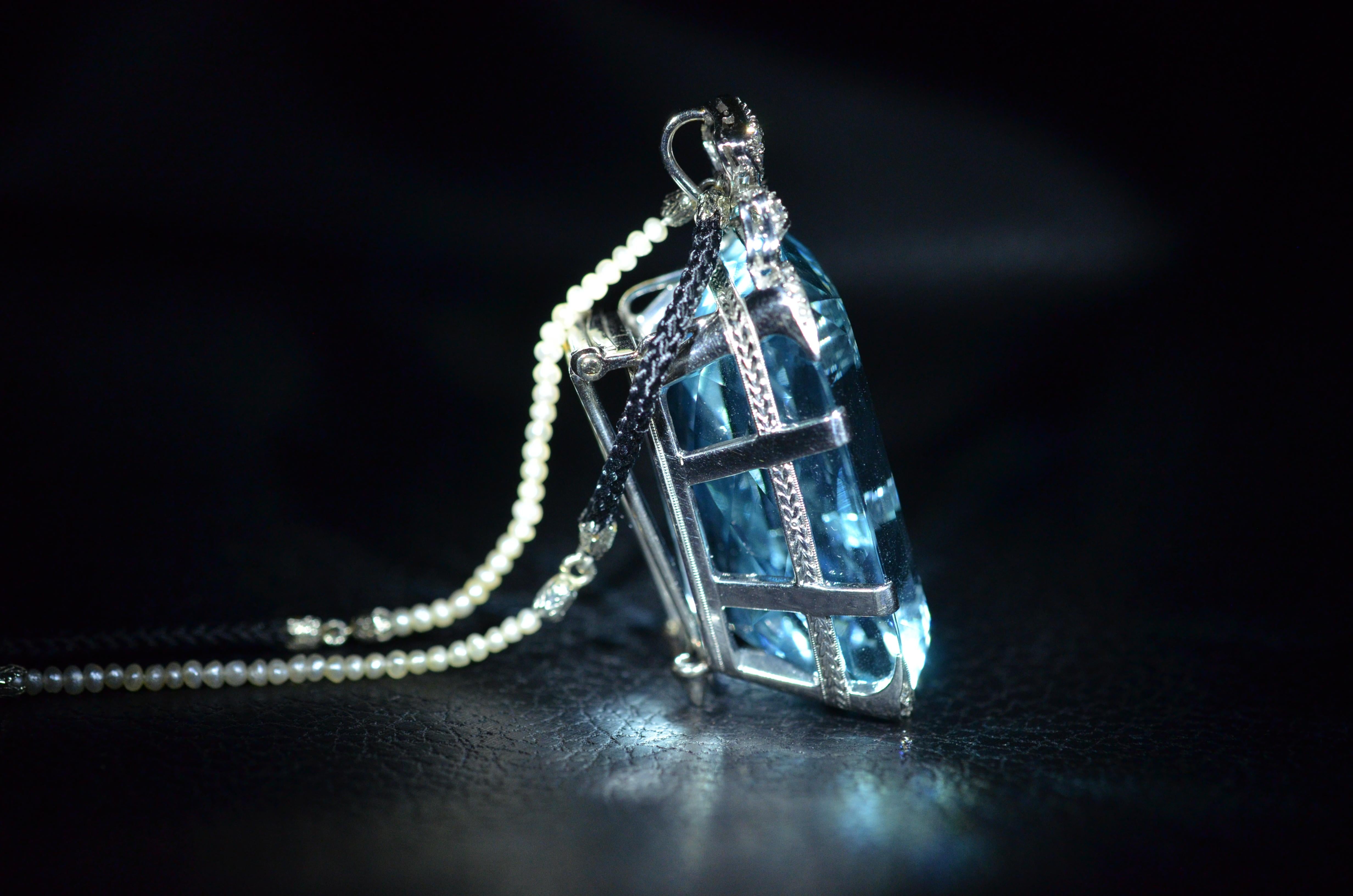 Incredibly exceptional original antique Edwardian platinum and diamond pendant.  Set with a near 100 carat (97 carat) natural and original mine Santa-Maria Aquamarine.  The stone is strong in saturation.  The pendant can also be worn as a pin simply