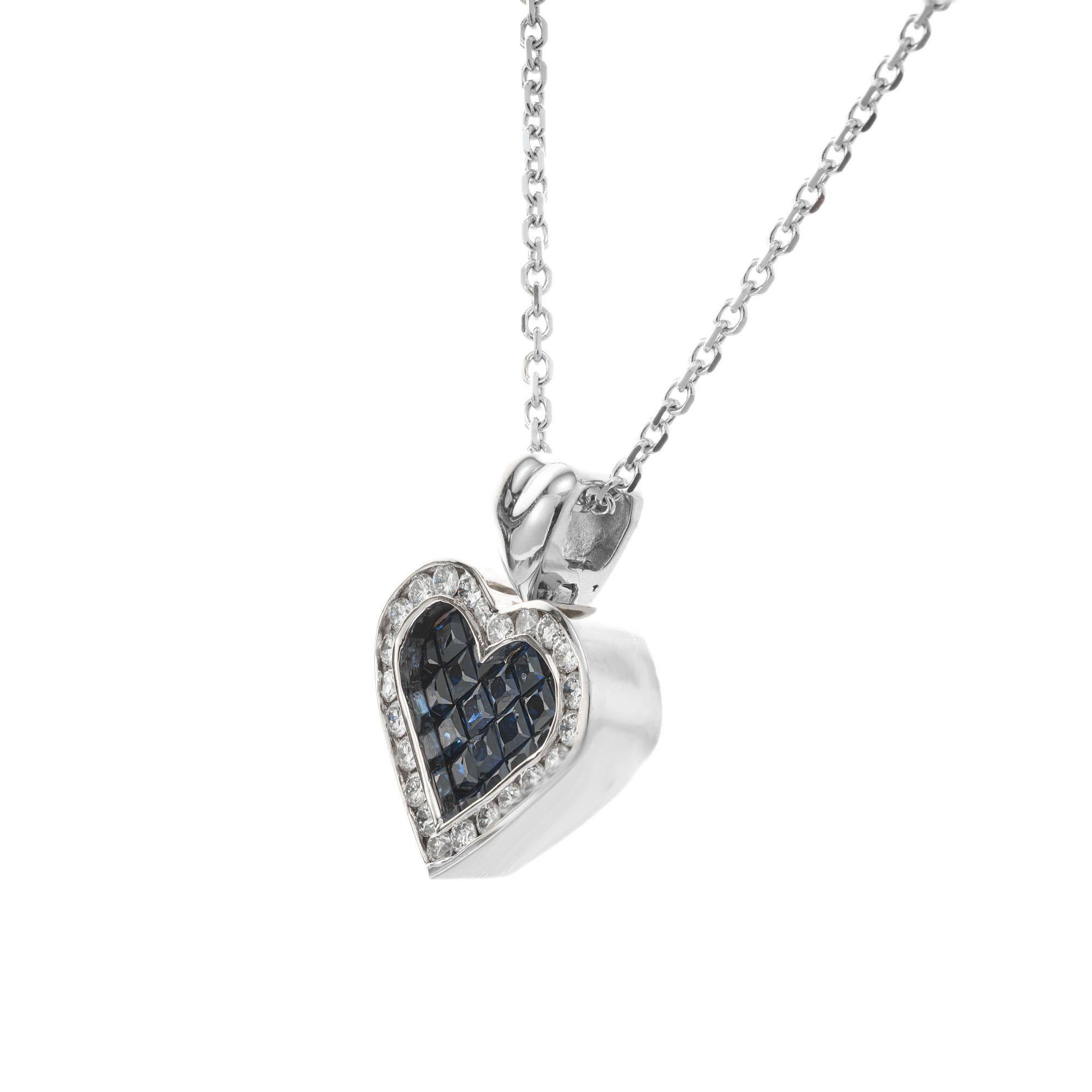 Sapphire and diamond heart pendant necklace. Invisible set blue square sapphire heart with a halo of round brilliant cut diamonds set in 18k white gold with a 16 inch 18k chain.

21 square cut blue sapphires, VS-SI approx. 1.00ct
23 round brilliant