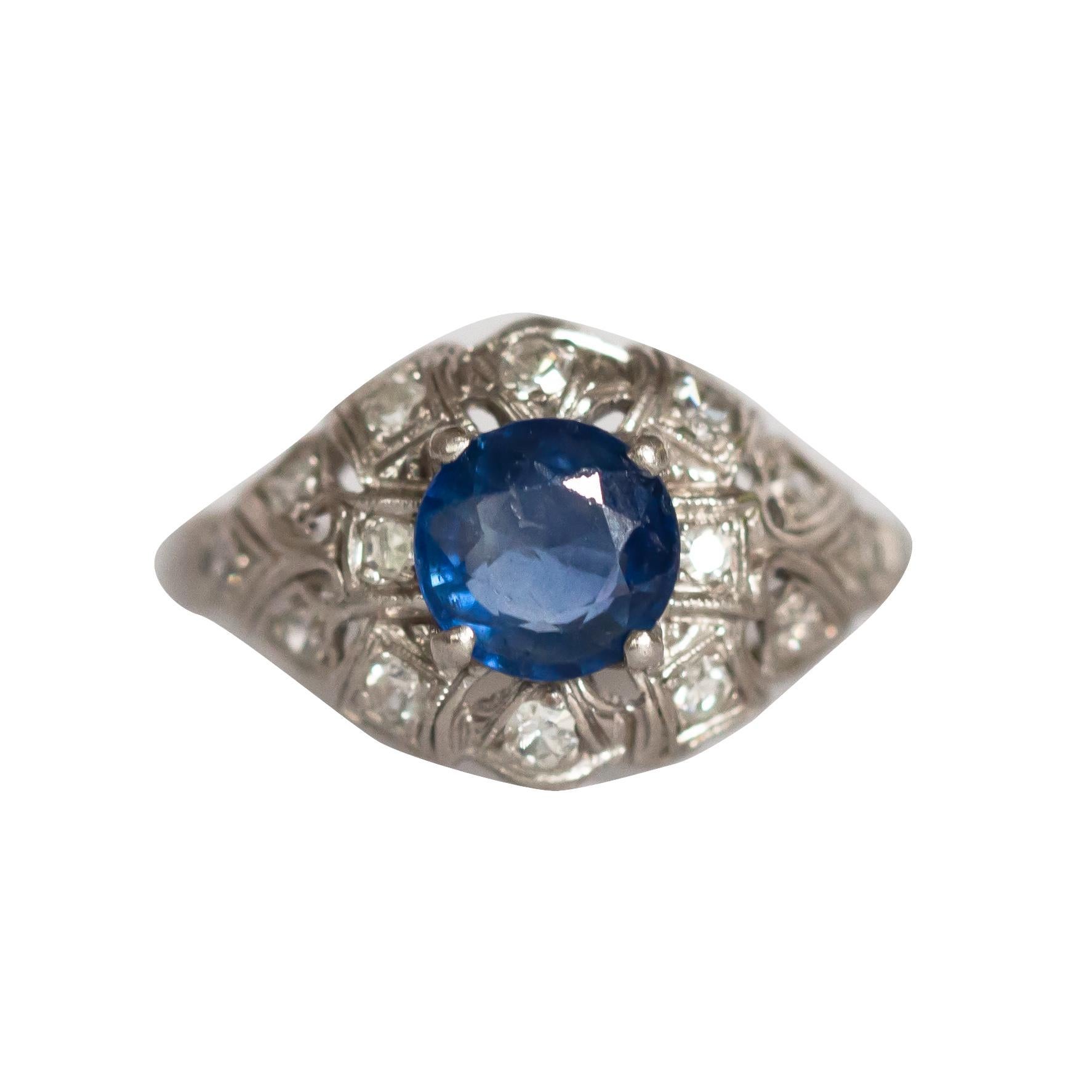Ring Size: 5.5
Metal Type: Platinum  [Hallmarked, and Tested]
Weight:  2.5 grams

Center Stone Details:
Type: Sapphire, Natural
Weight: 1.00 carat
Cut: Transitional Round
Color: Blue
Clarity: SI2

Side Diamond Details:
Weight: .15 carat, total