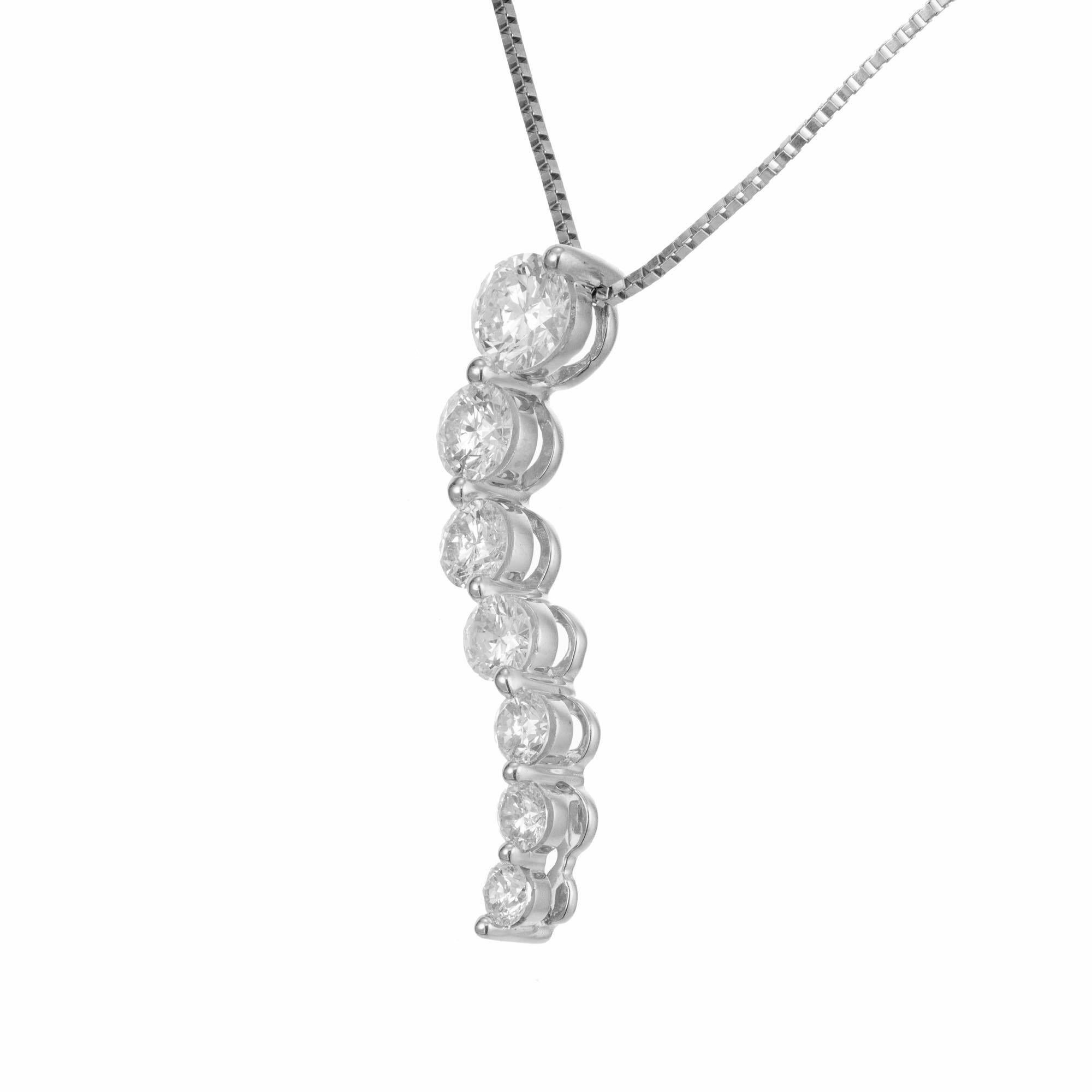Graduated diamond pendant necklace. 7 brilliant cut diamonds set in 14k white gold with a 19 inch long box chain. 

7 brilliant cut diamonds, .33ct to .05ct each, approx. total weight 1.00ct, G to H, SI1 to SI2
14k White Gold
Stamped: SEI 14k
2.7