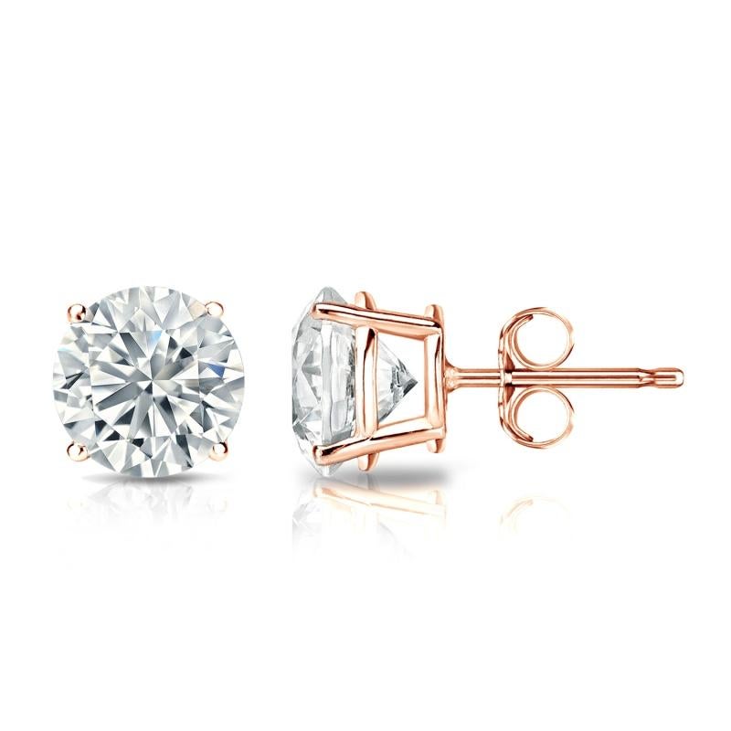 Stunning 14 Karat rose gold handmade earrings featuring 2 round brilliant cut diamonds weighing 1.00 carat total I-J color and I1 clarity. The stunning earrings measure 3.4 mm in diameter, these gorgeous earrings are classic and timelessly elegant.