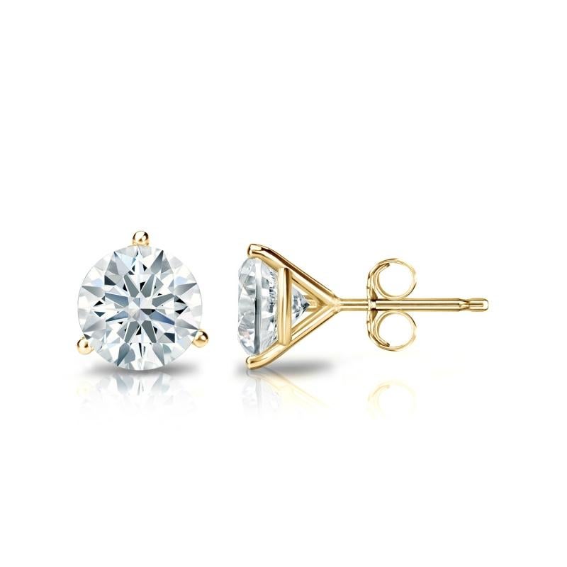 Stunning 14 Karat yellow gold handmade earrings featuring 2 round brilliant cut diamonds weighing 1.00 carat total I-J color and SI clarity. These gorgeous earrings are classic and timelessly elegant.