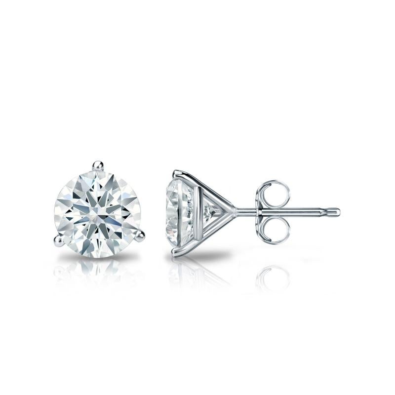 Stunning 14 Karat white gold handmade earrings featuring 2 round brilliant cut diamonds weighing 1.00 carat total I-J color and SI clarity. These gorgeous earrings are classic and timelessly elegant.
