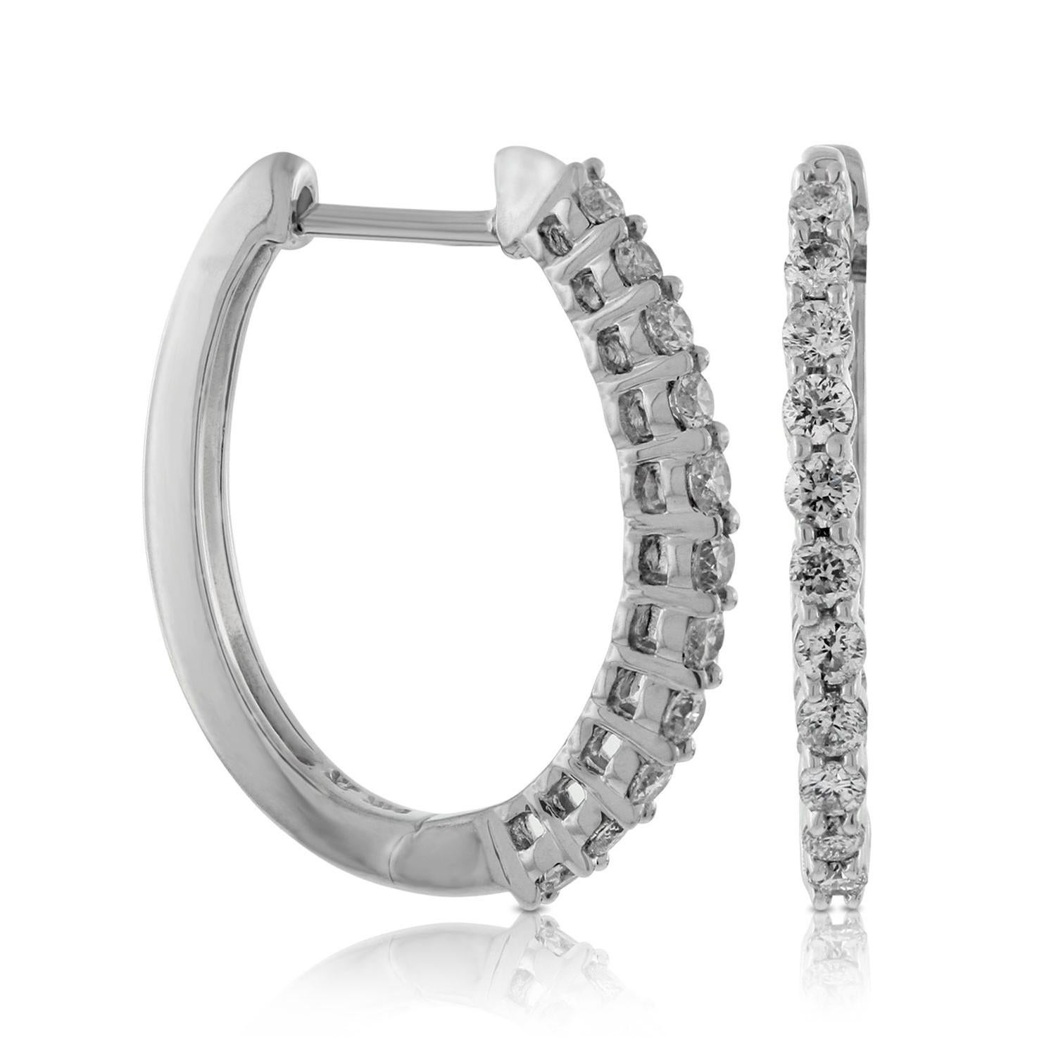 Nothing says luxury like an incredible pair of diamond oval hoop earrings. These stunning brightly polished 14 karat white gold outside oval-shaped hoop earrings feature a total of 24 round brilliant cut diamonds totaling 1.00 carats are prong set