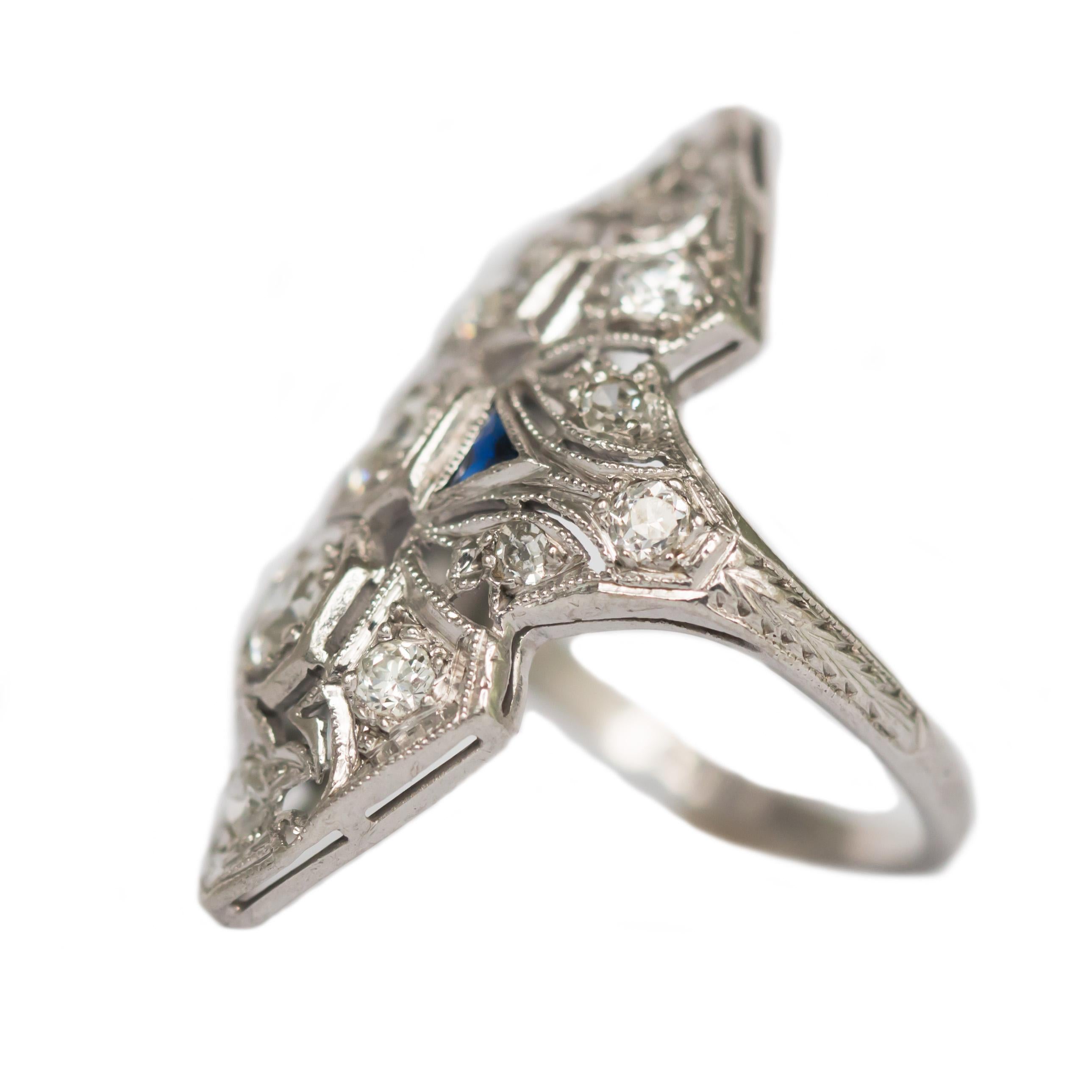 Ring Size: 5.5
Metal Type: Platinum
Weight: 5.2 grams

Center Diamond Details
Shape: Old European Brilliant 
Carat Weight: 1.00 carat, total weight
Color: I/J
Clarity: VS

Side Stone Details: 
Type: Natural Sapphire
Shape: Triangle Cut 
Total Carat