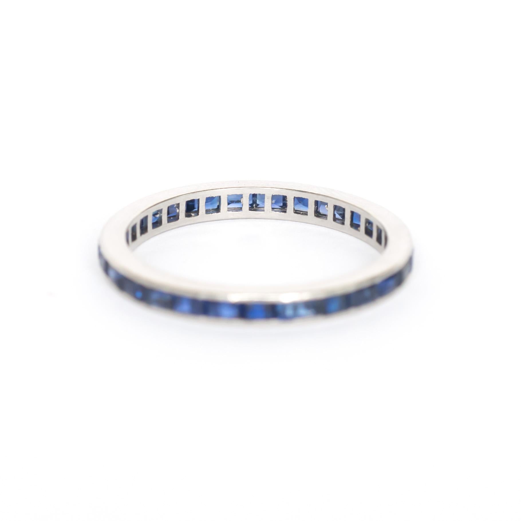 Ring Size: 5.95
Metal Type: 18 karat White Gold 
Weight: 1.9 grams

Color Stone Details: 
Type: Sapphire 
Shape: Princess Cut 
Carat Weight: 1.00 carat, total weight.
Color: Synthetic Deep Blue 

Finger to Top of Stone Measurement: 1.64mm
Width: