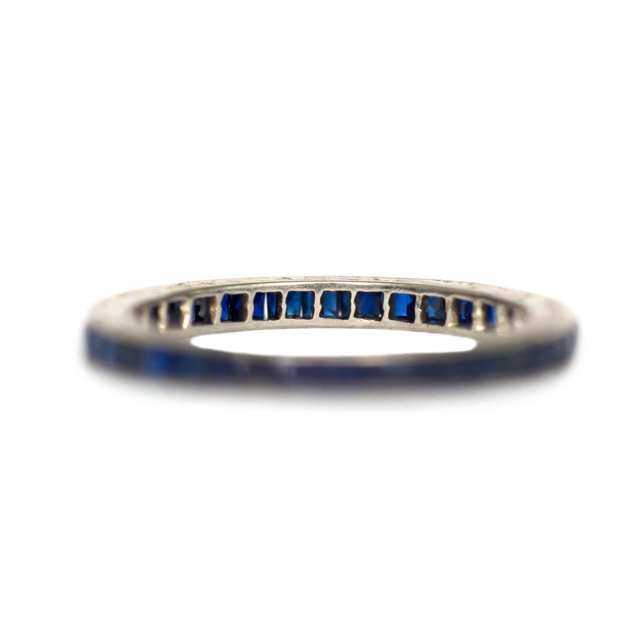 Ring Size: 5.25
Metal Type: 18 karat White Gold  [Hallmarked, and Tested]
Weight:  1.1  grams

Sapphire Details:
Weight: 1.00 carat, total weight
Cut: French cut
Color: Blue
Clarity: VS

Finger to Top of Stone Measurement: 1.5MM
Condition: 