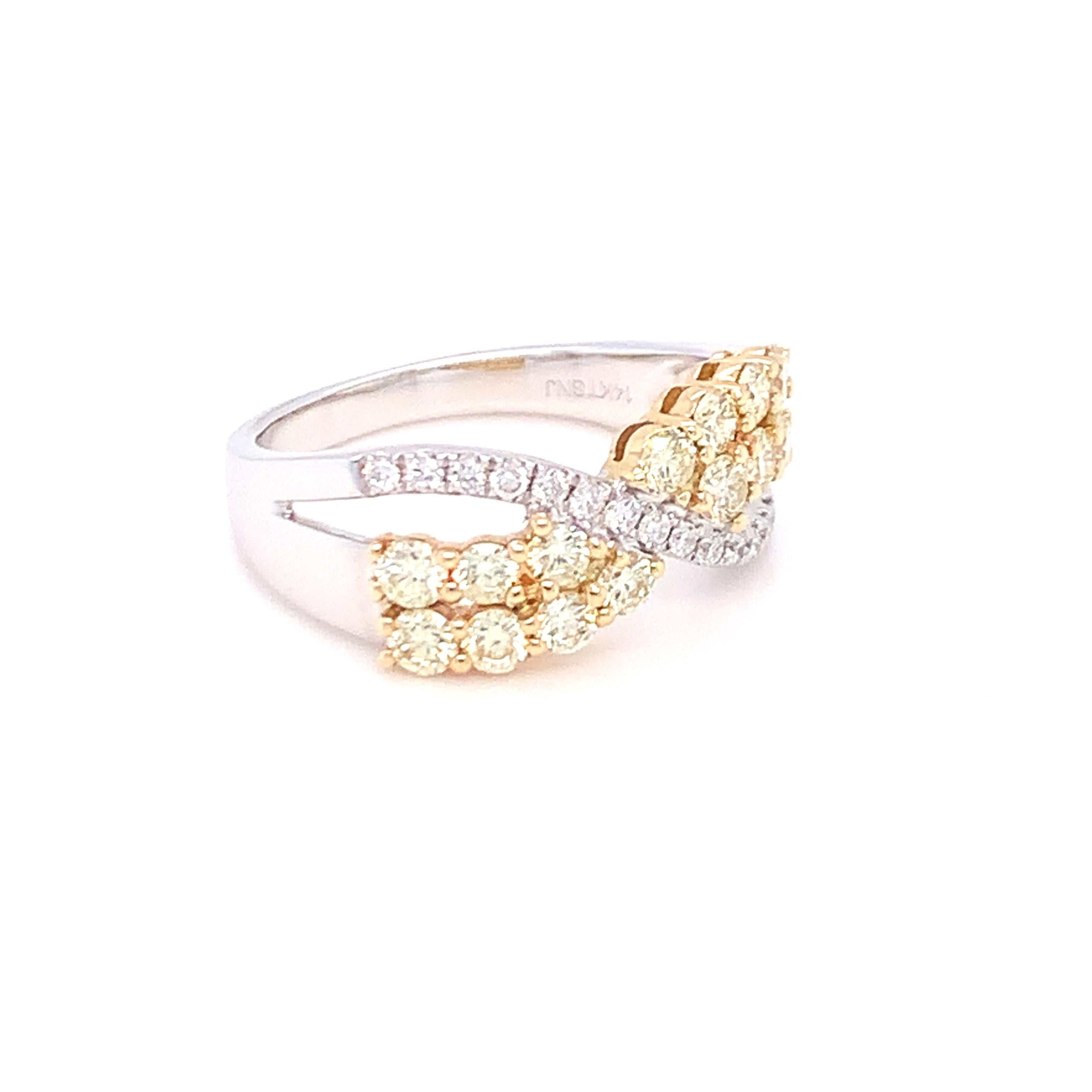 A combination of yellow and white diamond in style of a bow makes this band a beautiful piece of jewelry. Set in two tone gold and finished with skilled hands.
Yellow Diamond: 0.87ct
White Diamond: 0.13ct
Gold: 14K Two Tone
Ring Size:7