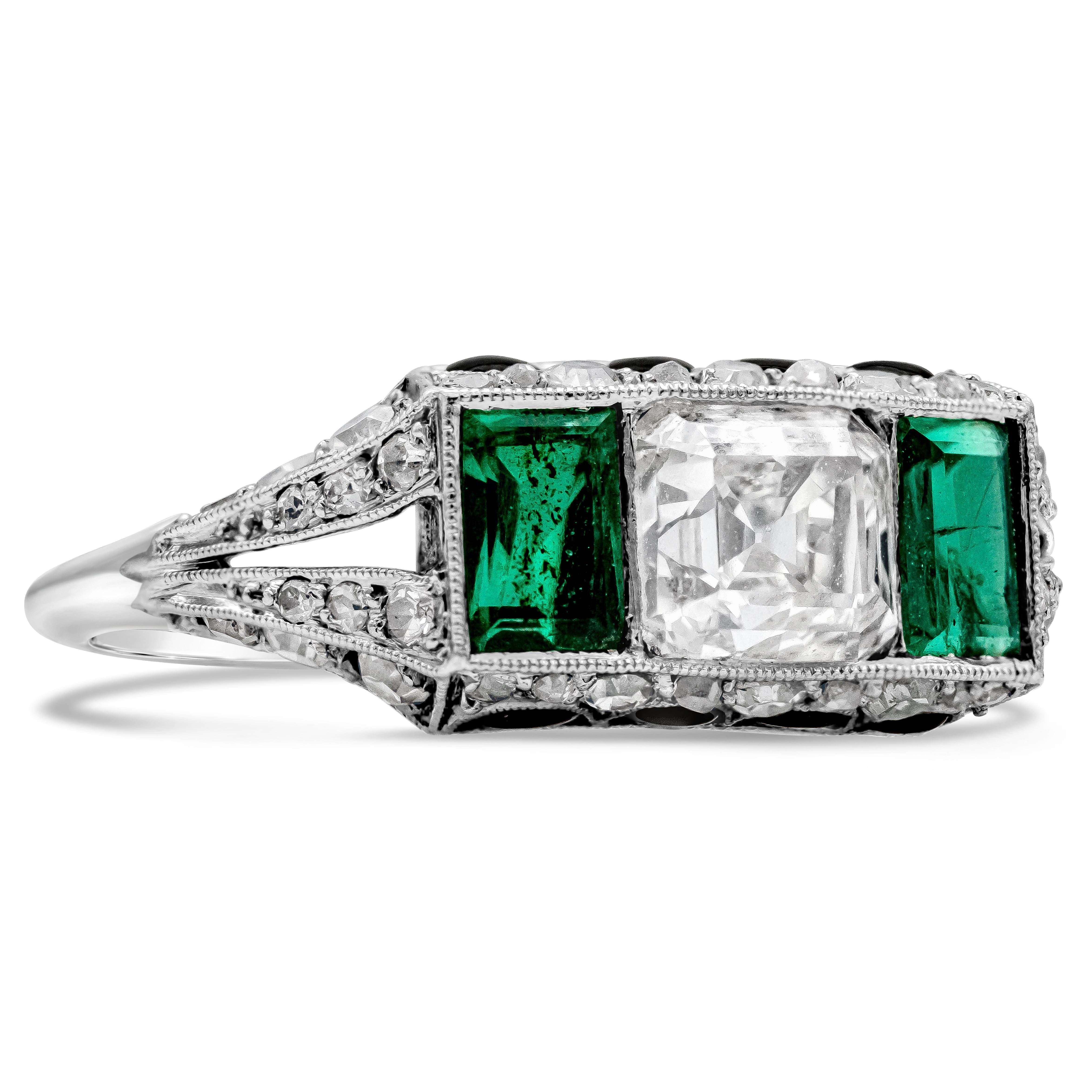 This antique engagement ring features an asscher cut diamond in the center weighing 1.00 carats, flanked by rectangular green emerald on each side weighing 0.70 carats total. Set in a split-shank setting and accented by 4 half-moon cut onyx on the