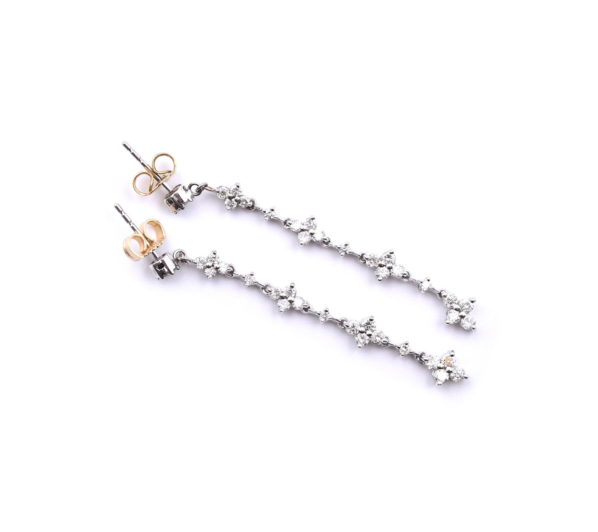 Designer: custom design
Material: 14k white gold
Diamonds: 52 round brilliant cuts = 1.00 carat weight
Dimensions: each earring is 2-inch long
Fastenings: friction backs
Weight: 3.26 grams

