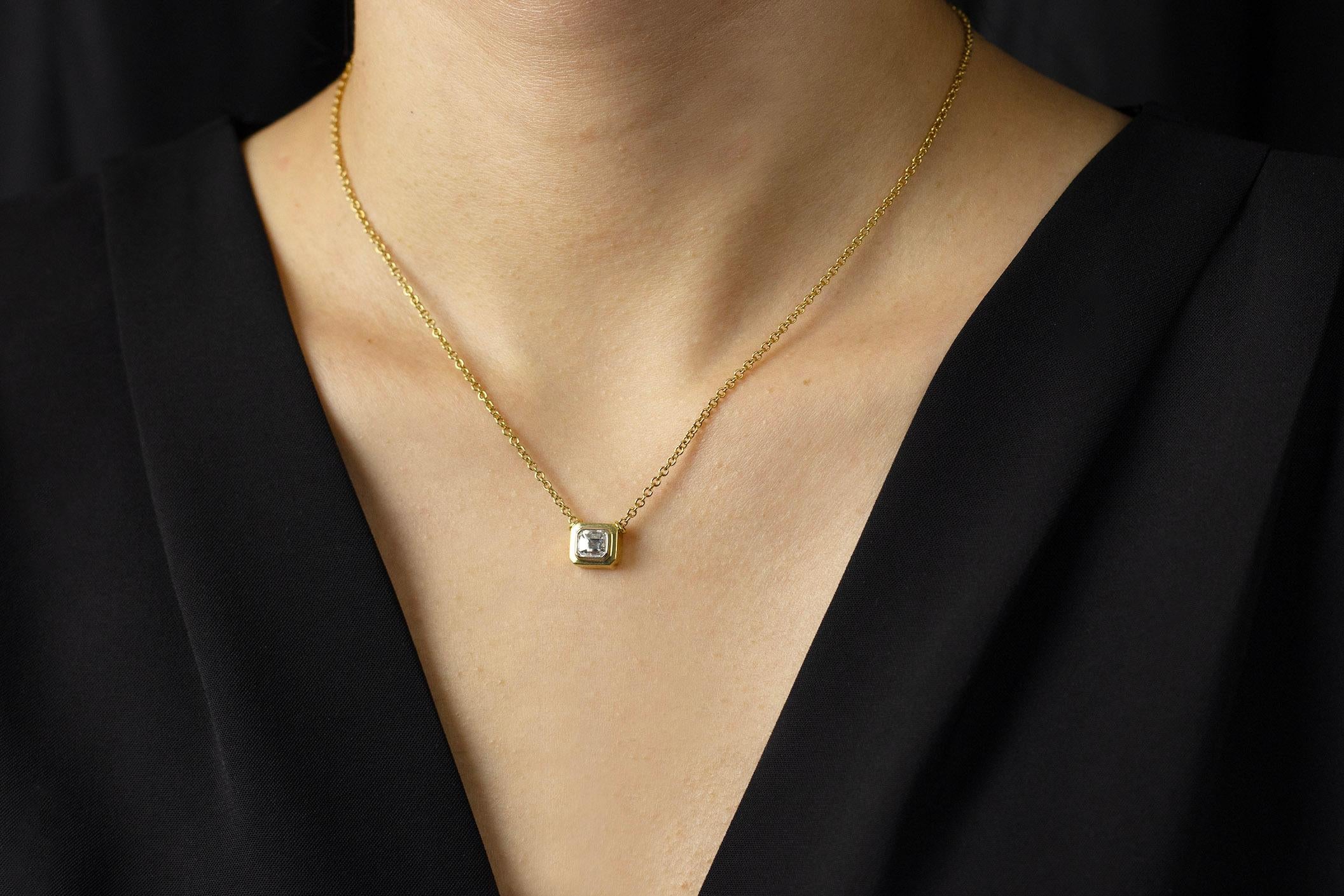Contemporary 1.00 Carats Emerald Cut Diamond Bezel Set Yellow Gold Pendant Necklace