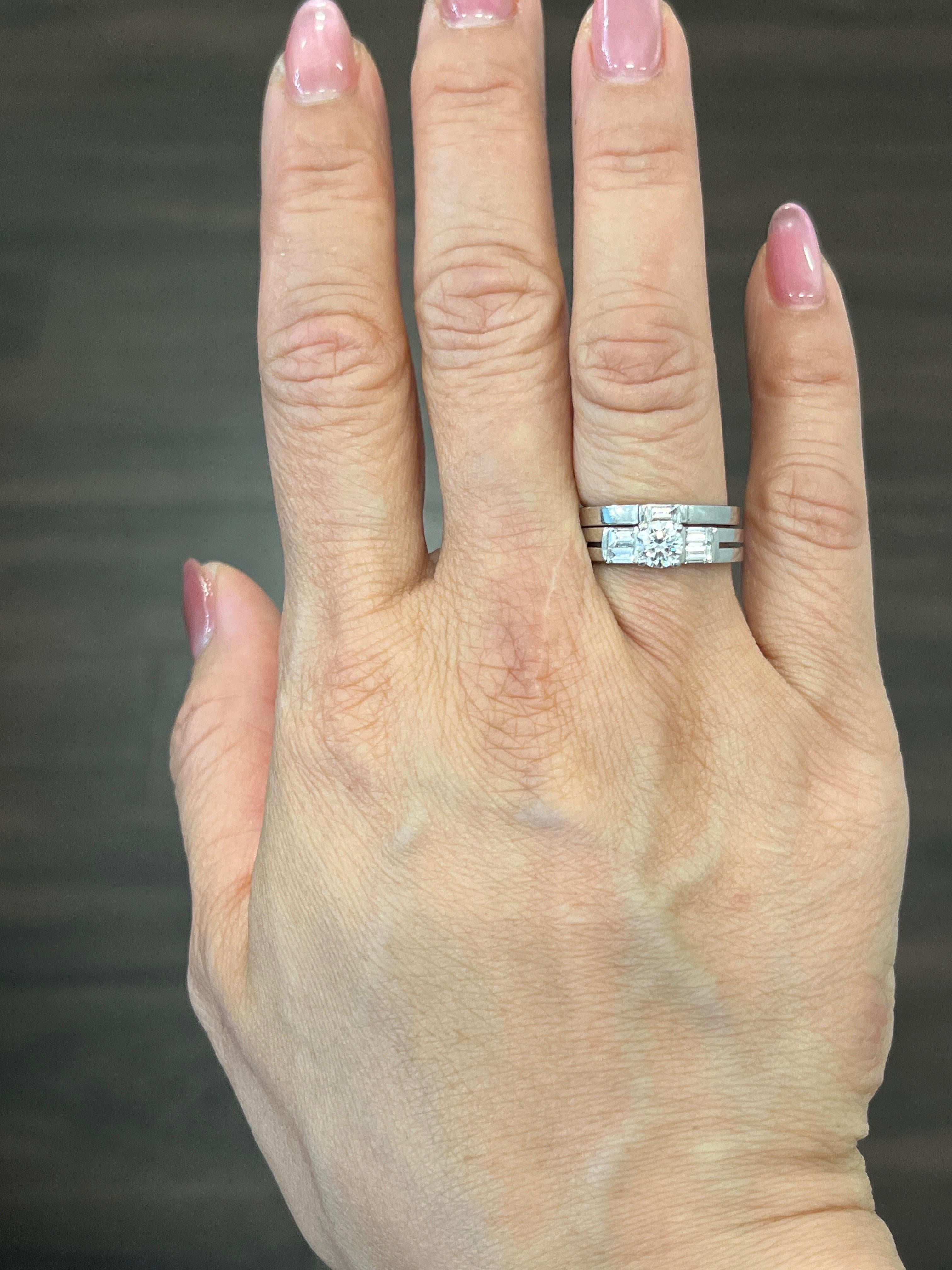 This stunning diamond engagement ring set features a center stone weighing 0.50 ct and 5 baguette diamonds weighing 0.50 ct set in platinum. The center stone boasts a color G, and a clarity of SI1. The baguettes are F in color, VS1 in clarity. A