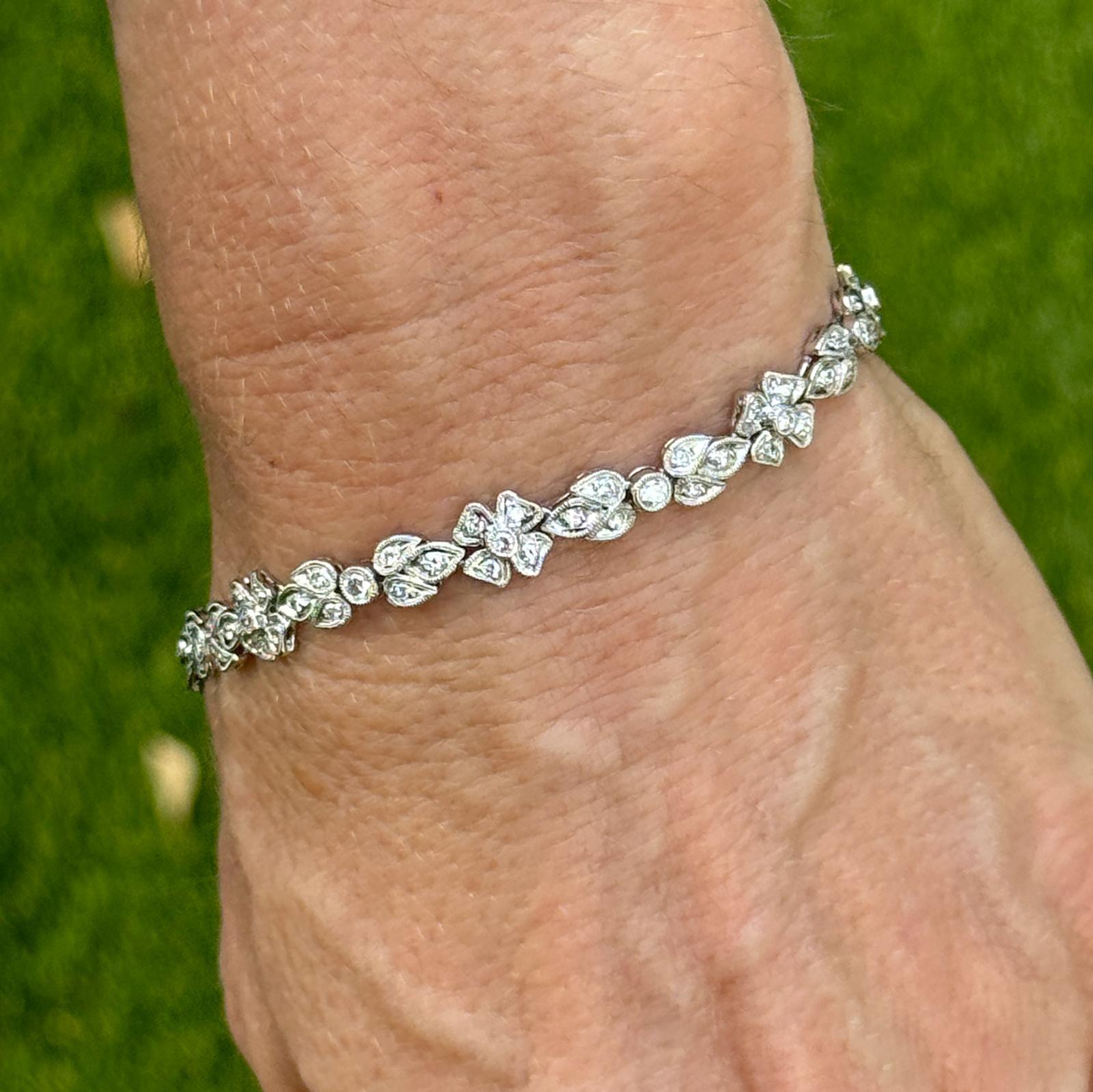 This exquisite bracelet showcases a stunning 1.00 carat total weight of round brilliant diamonds, expertly set in a luxurious platinum floral design. Each diamond is meticulously selected for its exceptional clarity and brilliance, enhancing the